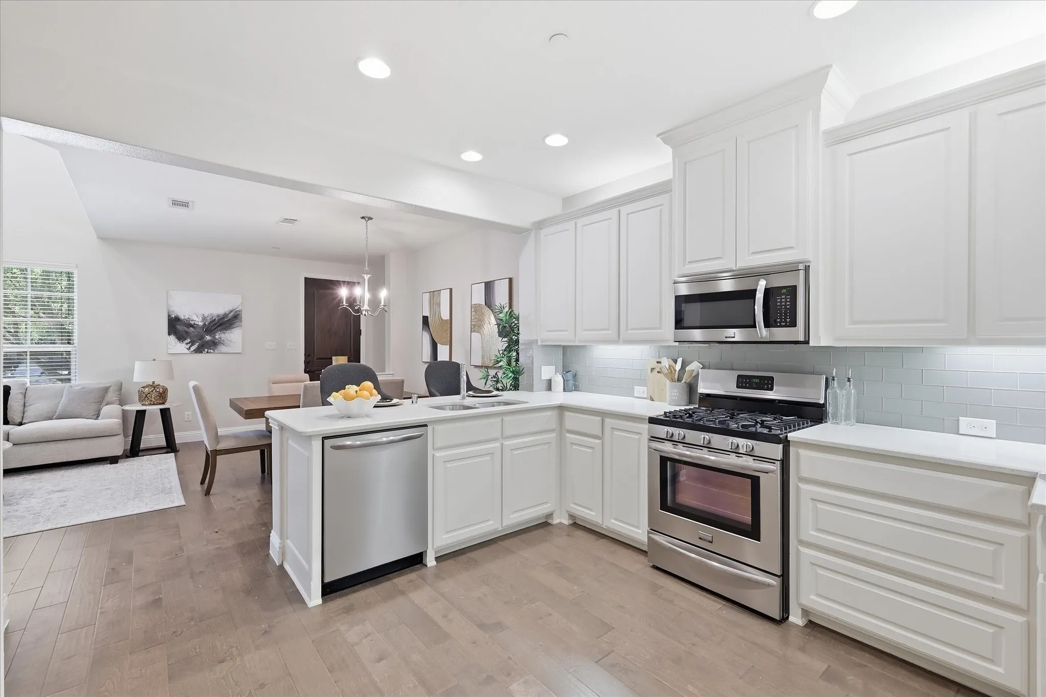 Kitchen opens to the entry and dining area, creating an easy flow for daily living.