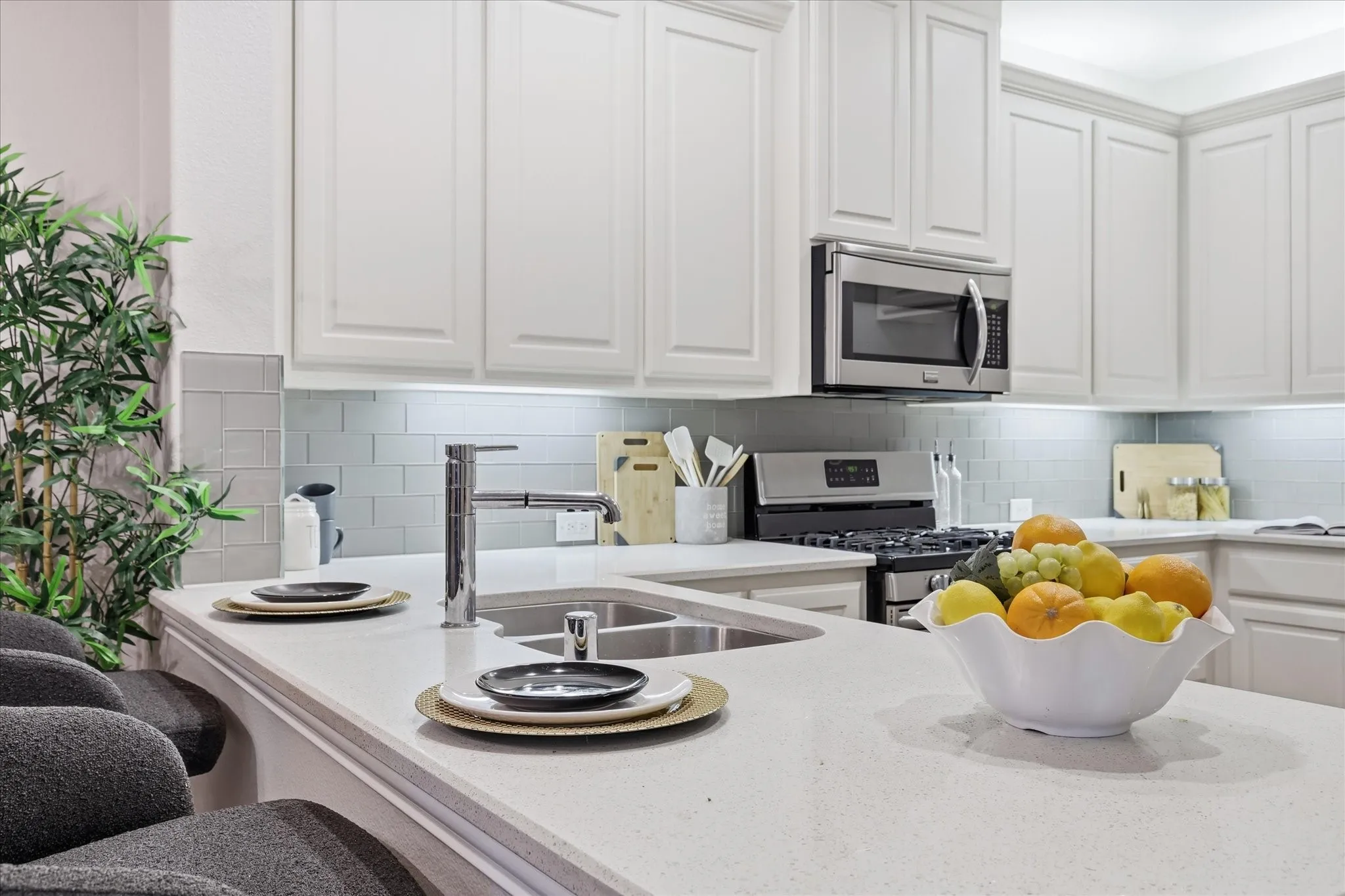 glass tile backsplash bring a fresh, modern finish to the kitchen