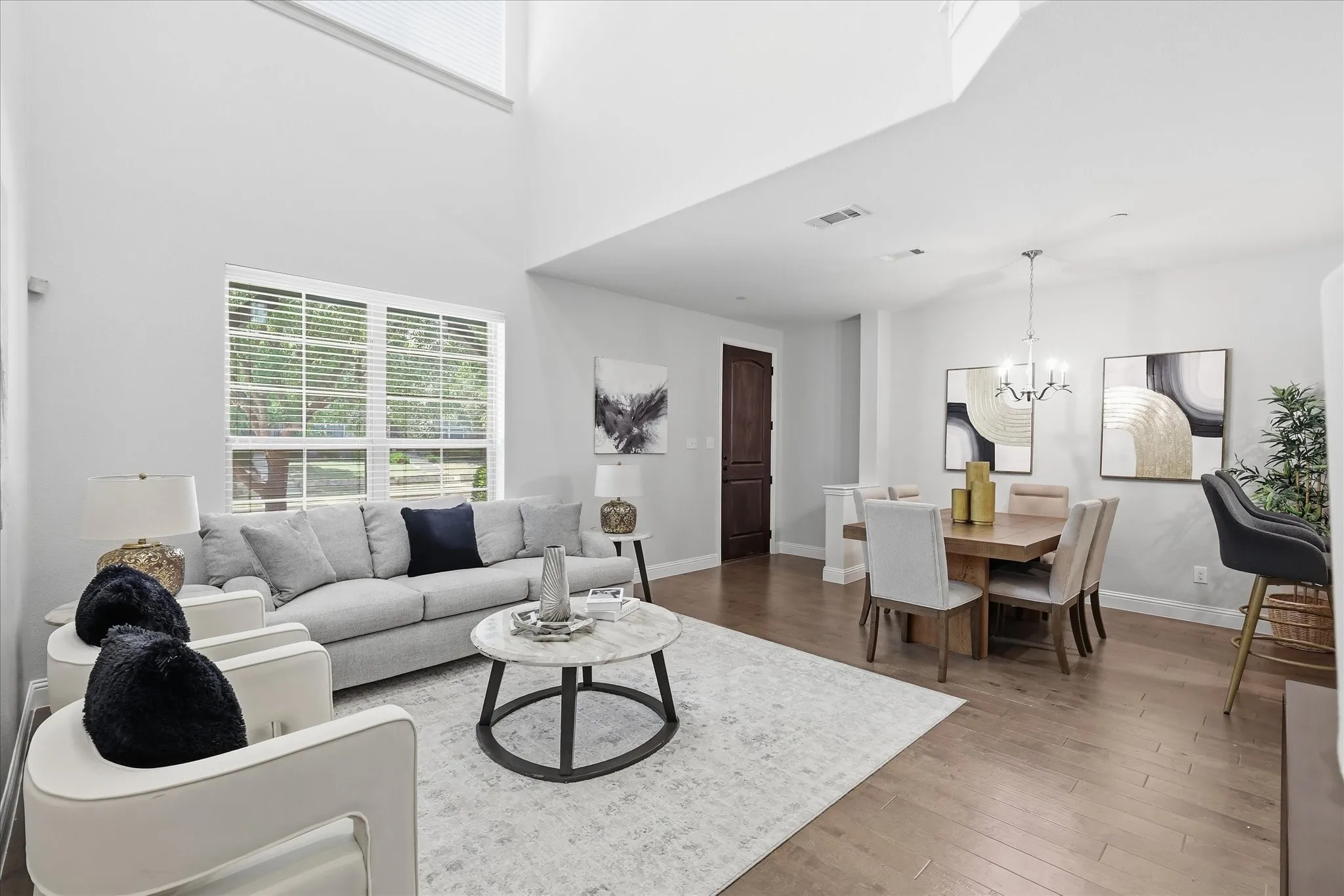 Vaulted ceilings and abundant natural light define the open-concept living space.