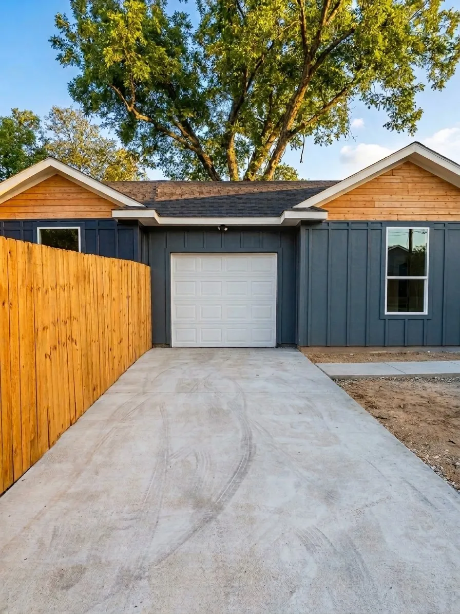 Concrete driveway leading to a single garage