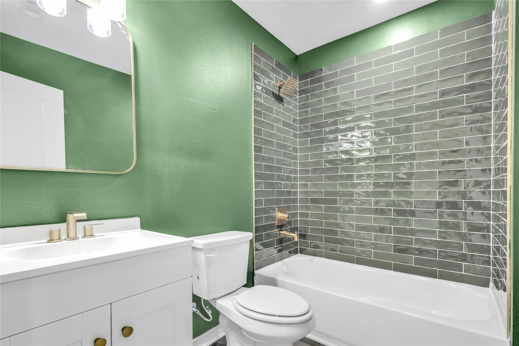 Custom tile shower, gold fixtures