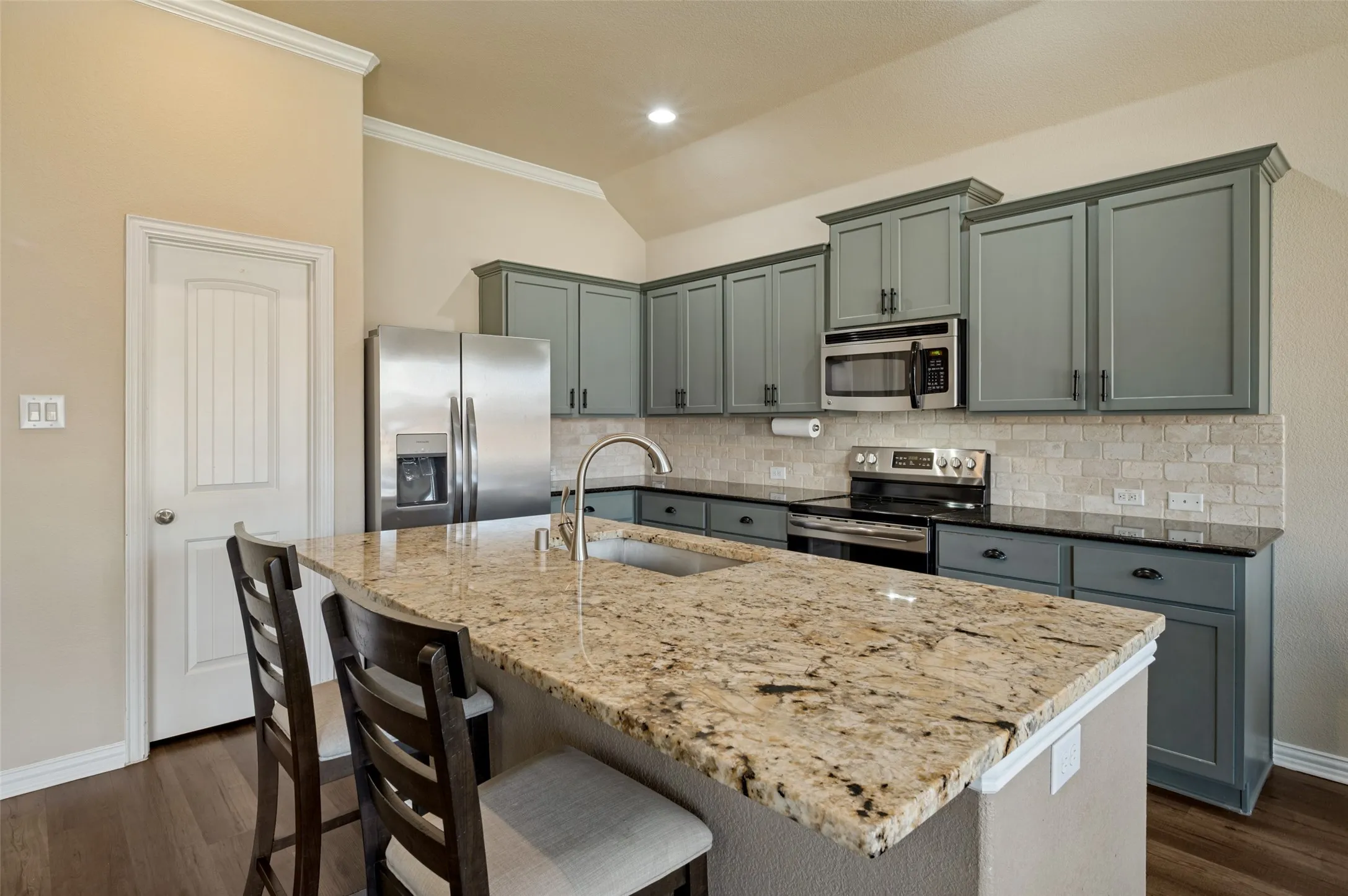 Granite counters, abundant cabinet space, pantry.