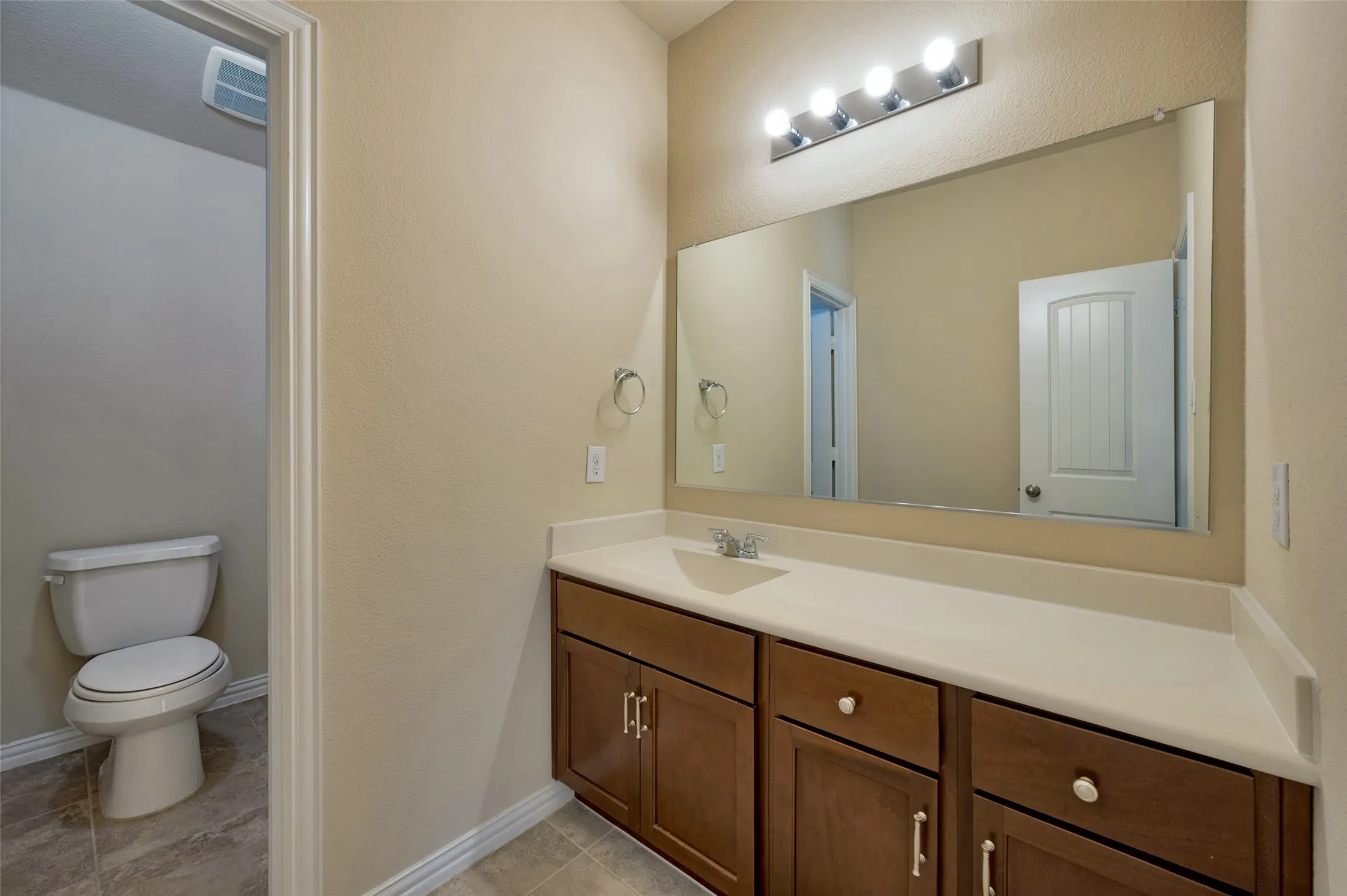 Second floor bathroom with two adjacent secondary bedrooms.