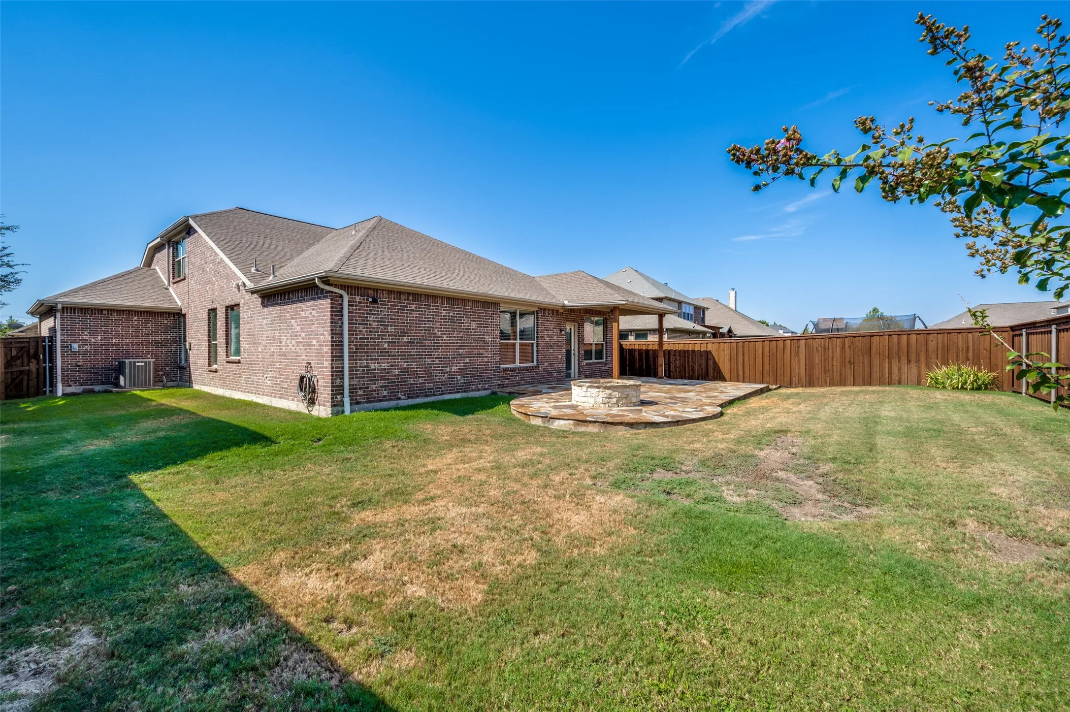 Oversized lot with board on board privacy fence.