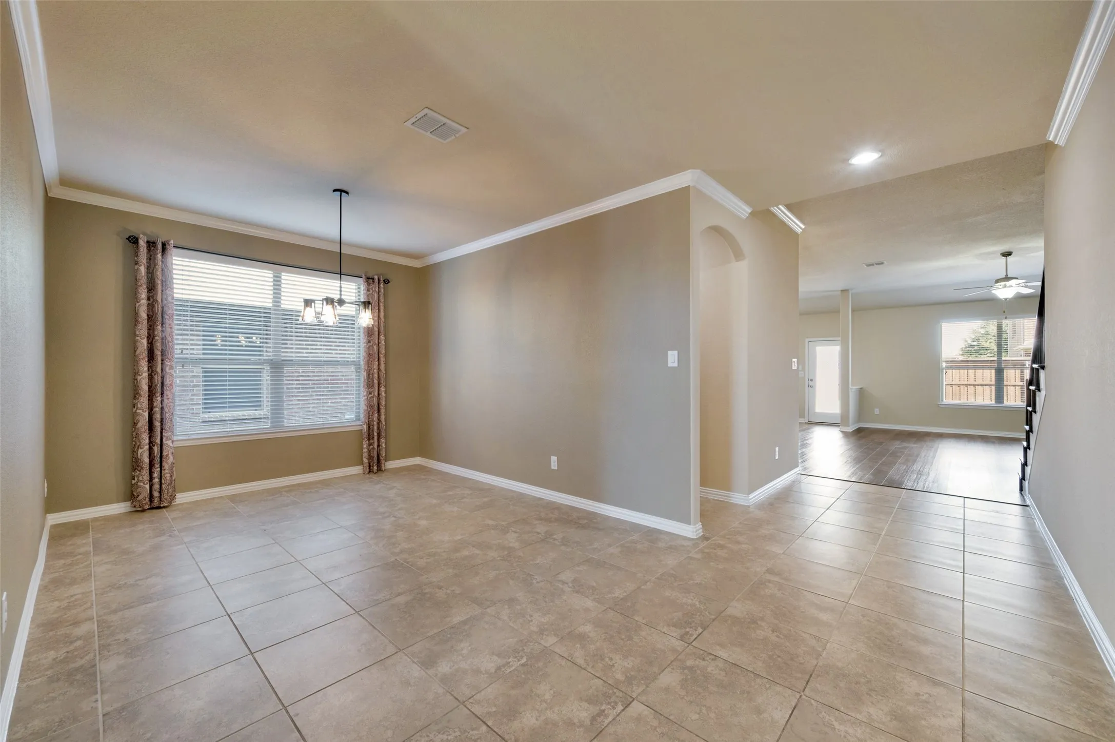 The entry leads past a guest bedroom and adjacent bath to the formal dining​​‌​​​​‌​​‌‌​‌‌​​​‌‌​‌​‌​‌​​​‌​​ room.