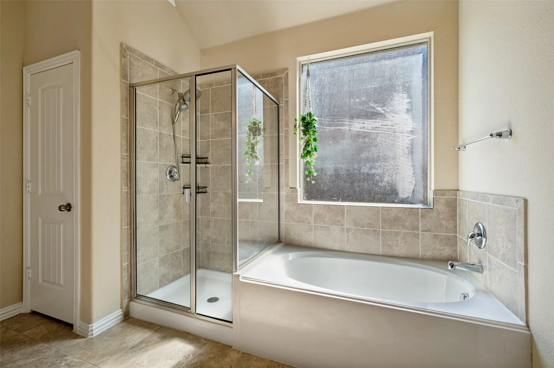 Primary bath garden tub, separate shower.