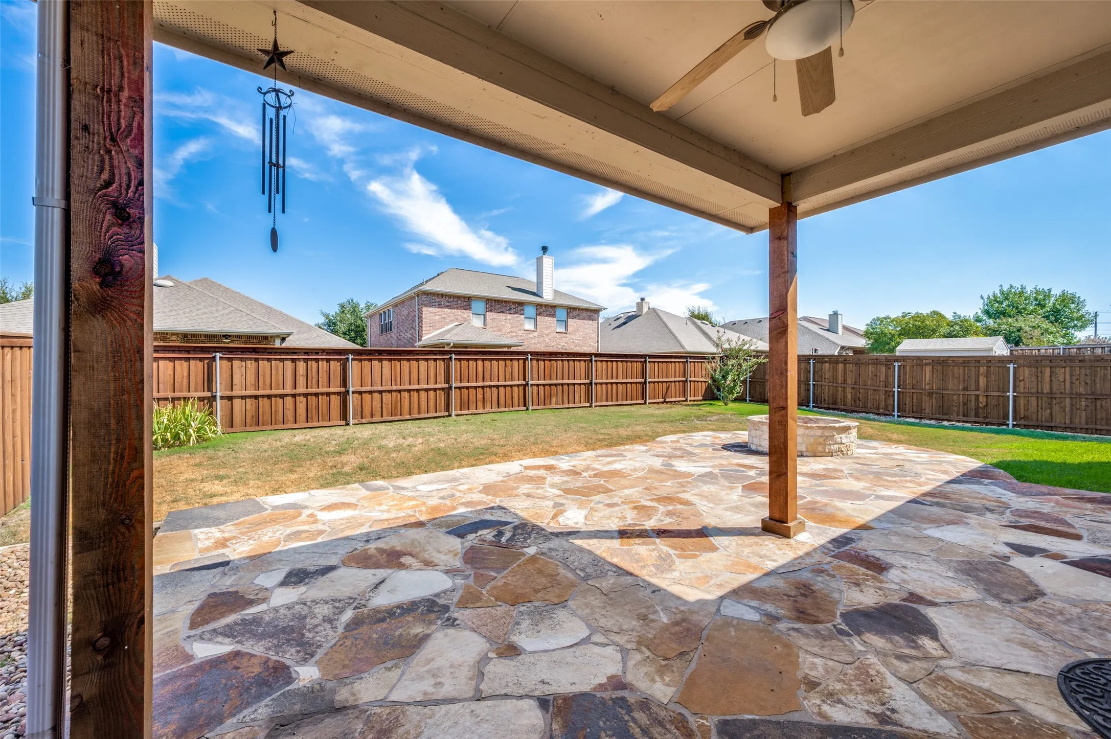 Oversized lot, extended covered patio with firepit.