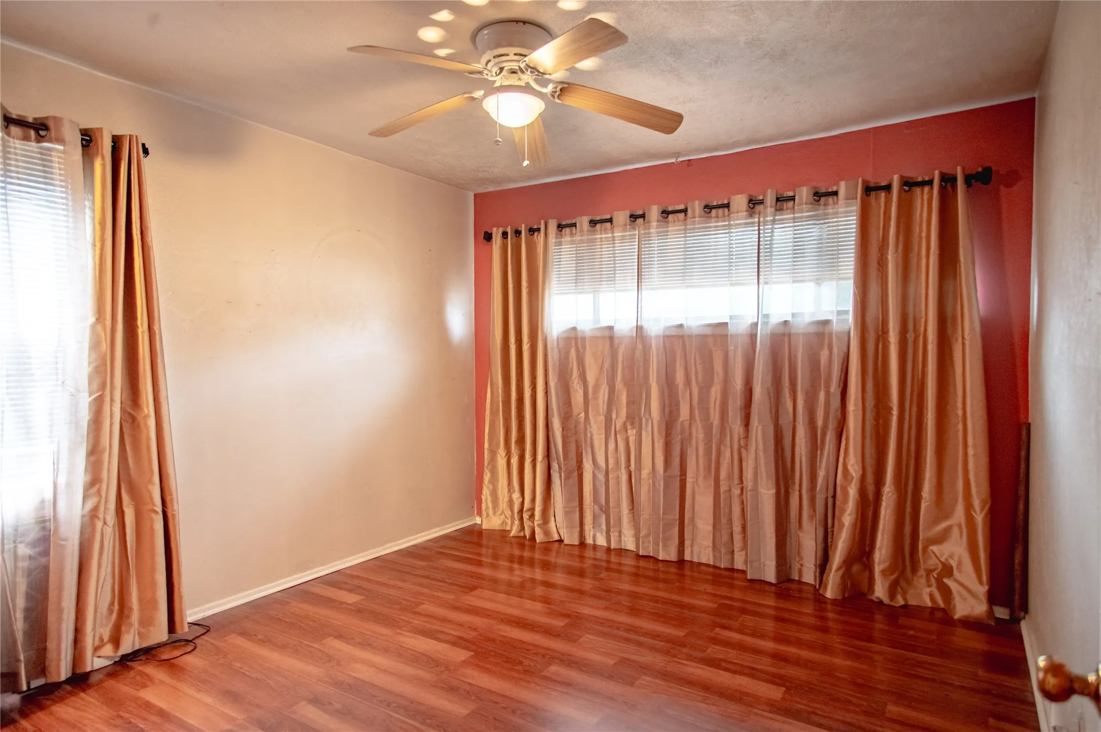 Luxury Vinyl Plank with a ceiling fan light fixture