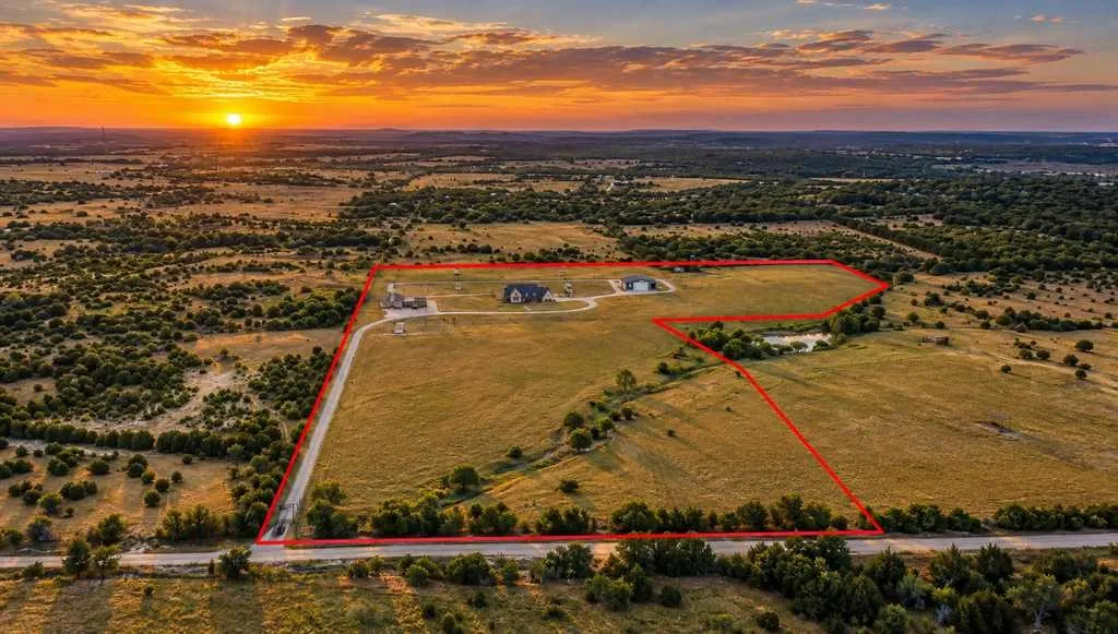Aerial view of the rural setting. Additional adjacent acreage offered separately, subject to availability.
