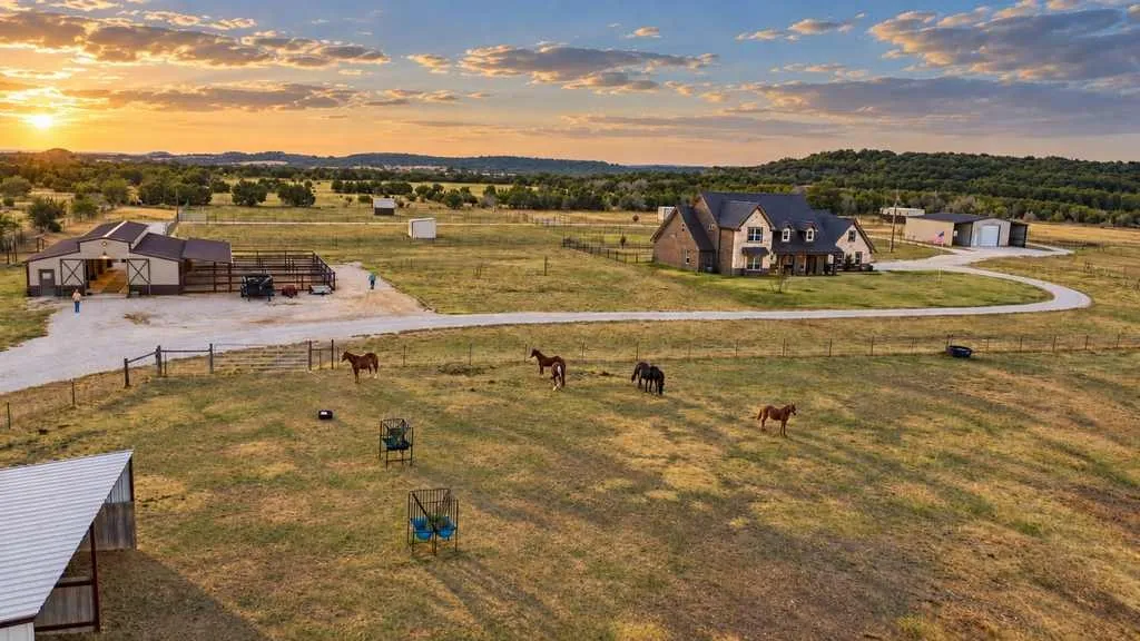 Pasture view toward the home highlights the open country setting.