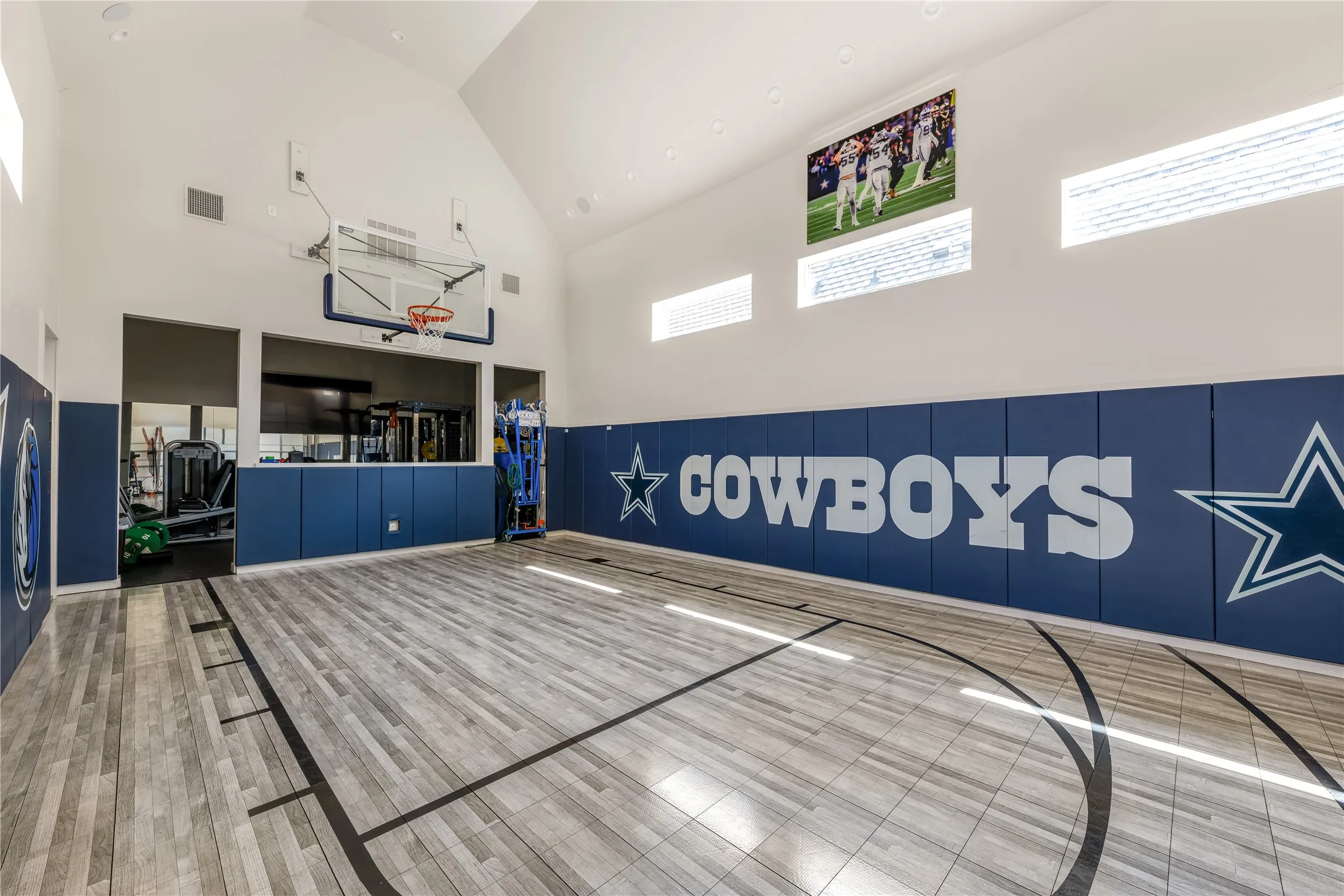 Indoor basketball court with full gym.