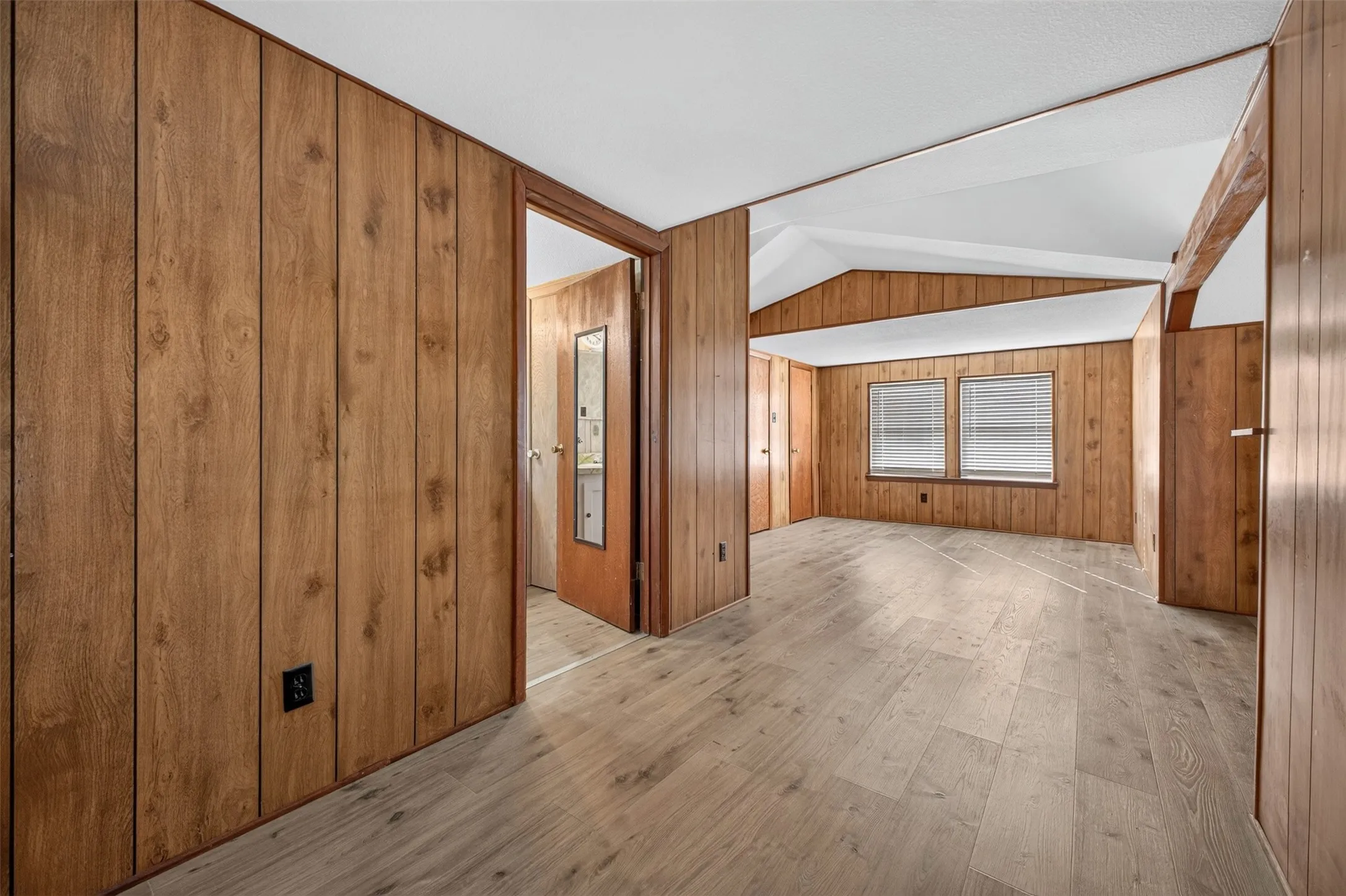 Wood-finish paneling, vaulted ceilings, and wood-finish flooring