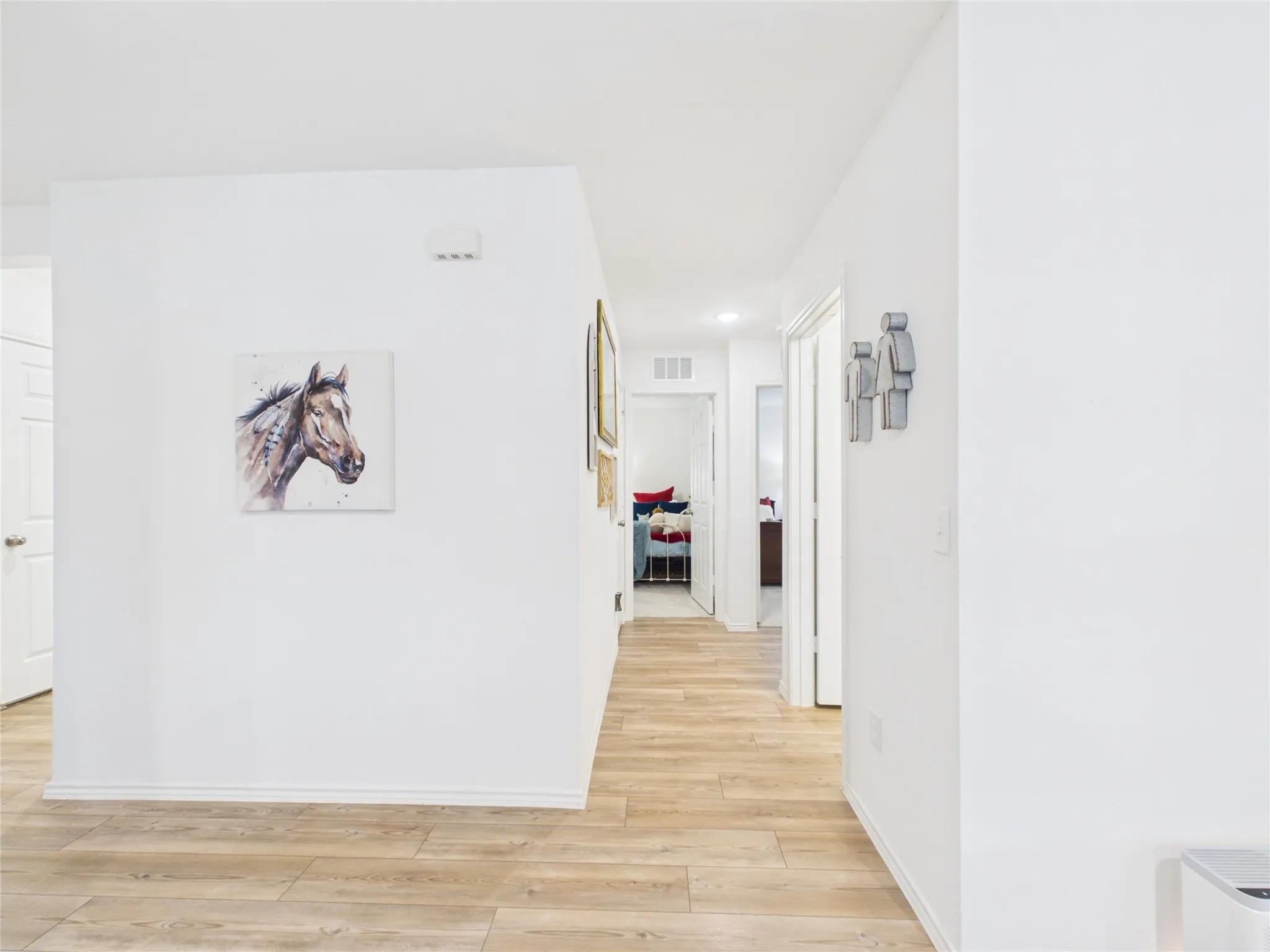 Hallway to the secondary bedrooms and bathroom