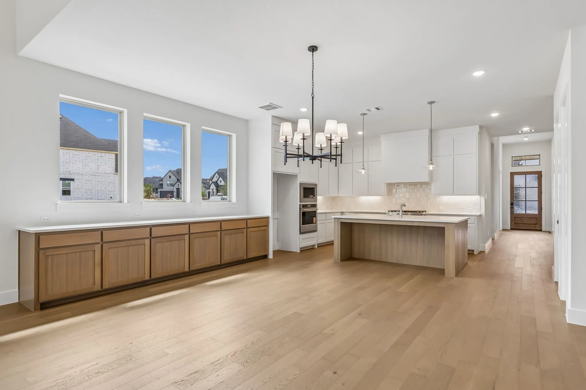 Featuring built in cabinets and a wall of windows in the dining room, you'll find entertaining is a breeze in this outstanding floor plan!