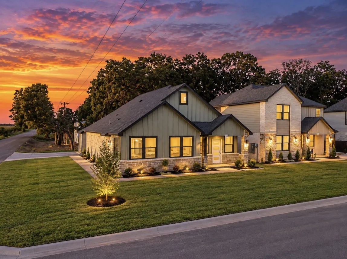 Stone and vertical siding exterior with gabled roof lines