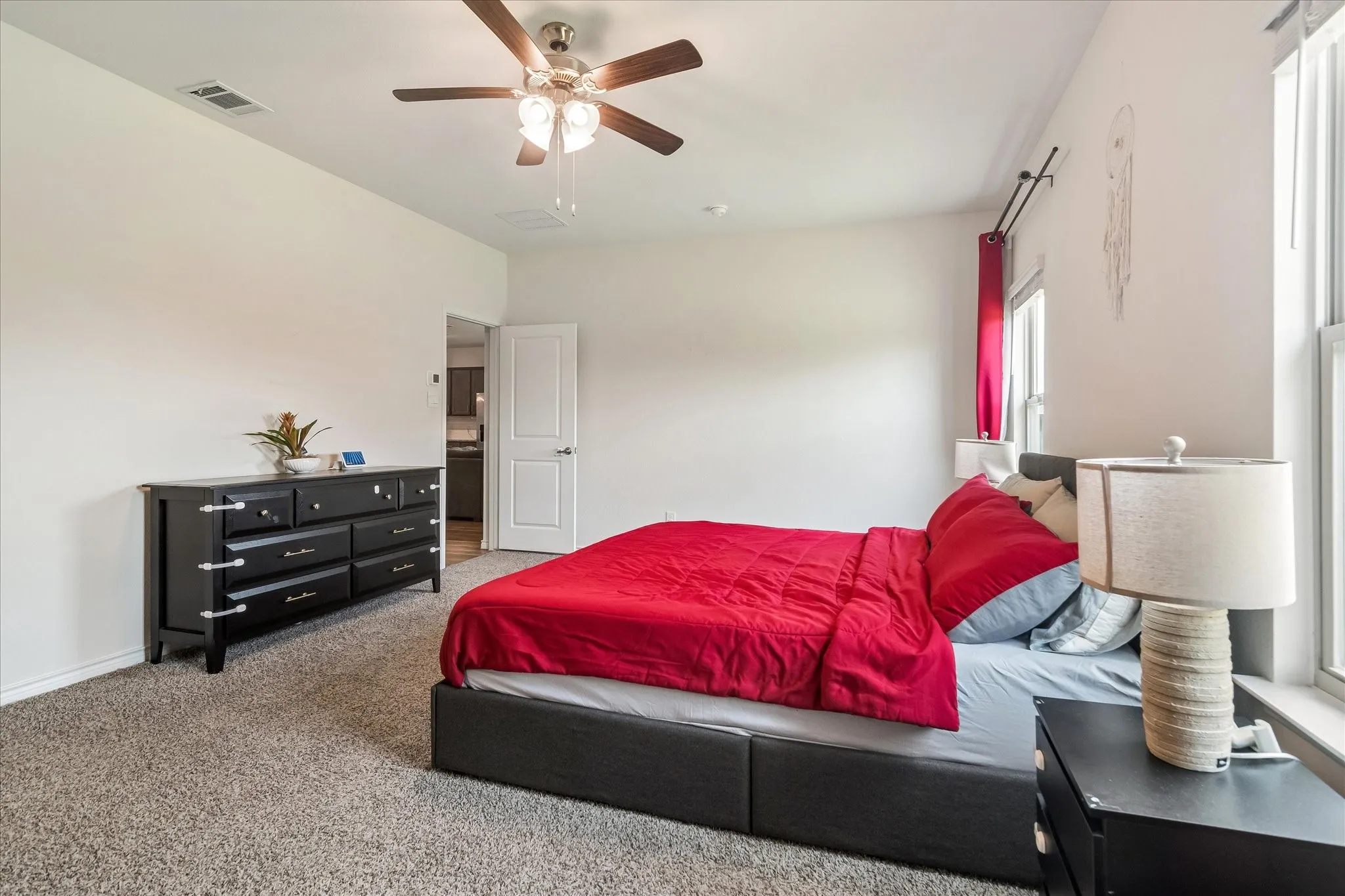 Neutral wall tones with installed ceiling fan lighting