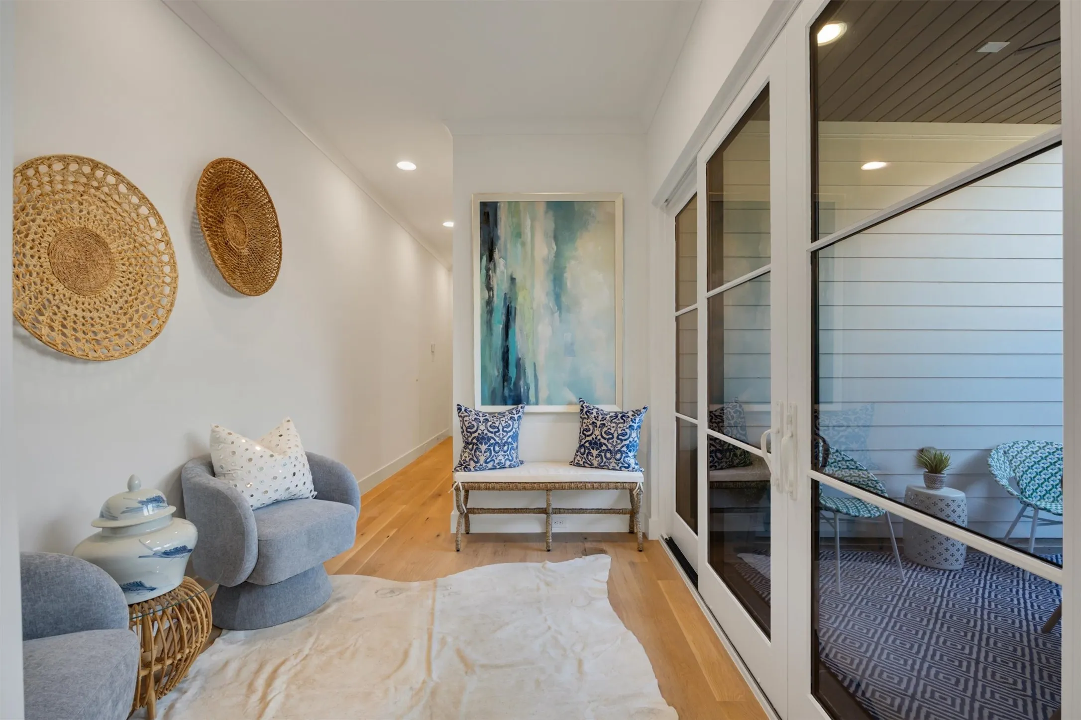 A relaxing, intimate conversation area with a view of the covered patio.