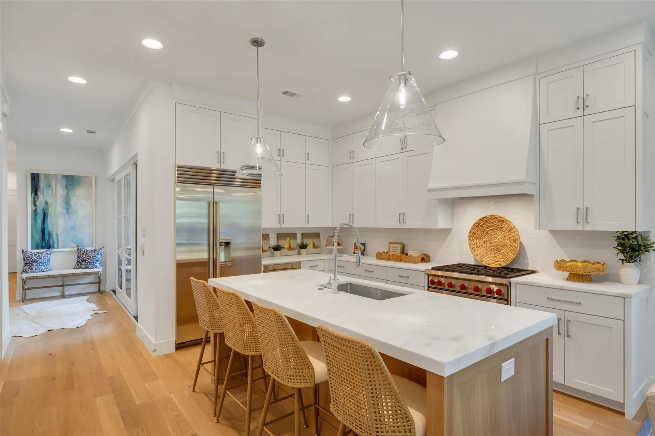 The kitchen features real marble countertops, A built in Sub-Zero fridge/freezer and WOLF range with 6 gas burners. There's also a microwave drawer and large walk-in pantry.