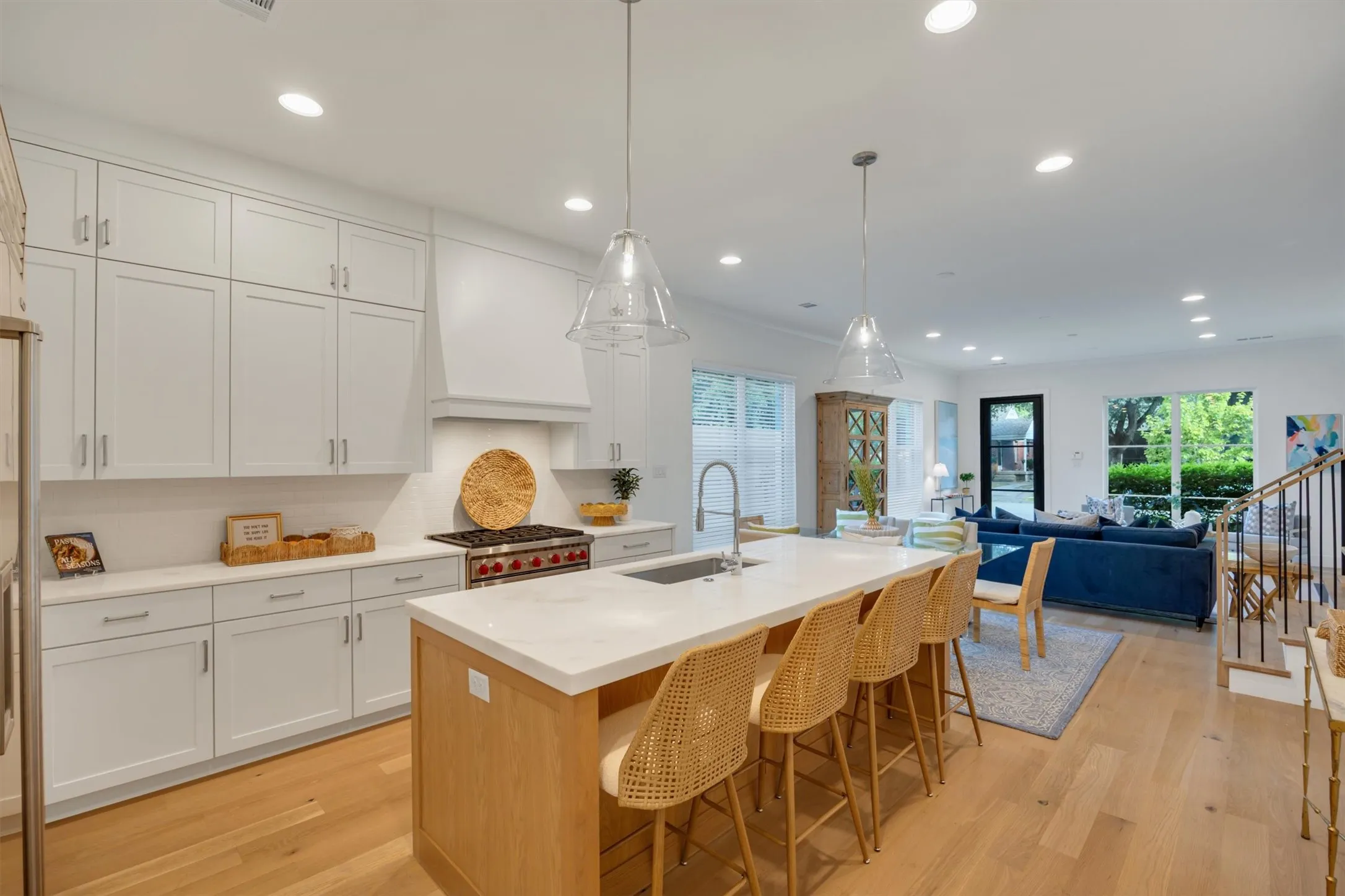 A large island is the centerpiece of the kitchen. It has a pull-out waste drawer with 2 bins. Trash and recycle. It also houses the ASKO stainless steel dishwasher.