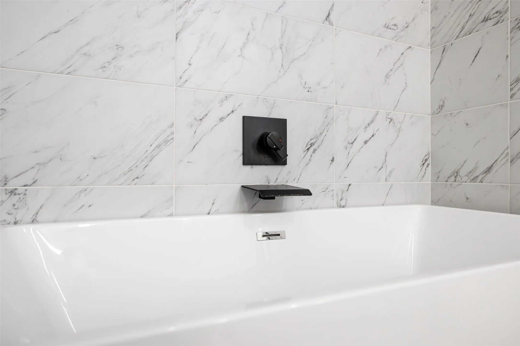 Luxury Waterfall soaking tub in primary bath