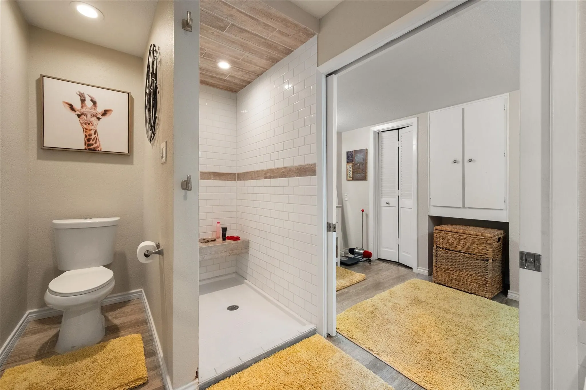 Shower with subway tile, wood-finish ceiling, and built-in bench