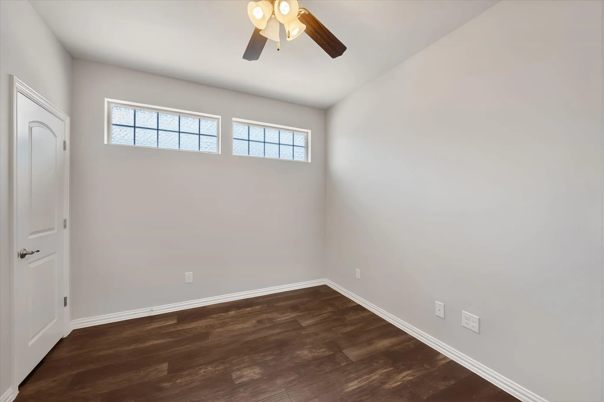 Flexible office or potential third bedroom offers versatility for a home office, study, guest room or additional sleeping space. Rich wood flooring, a closet and high clerestory windows provide functionality, natural light and privacy.