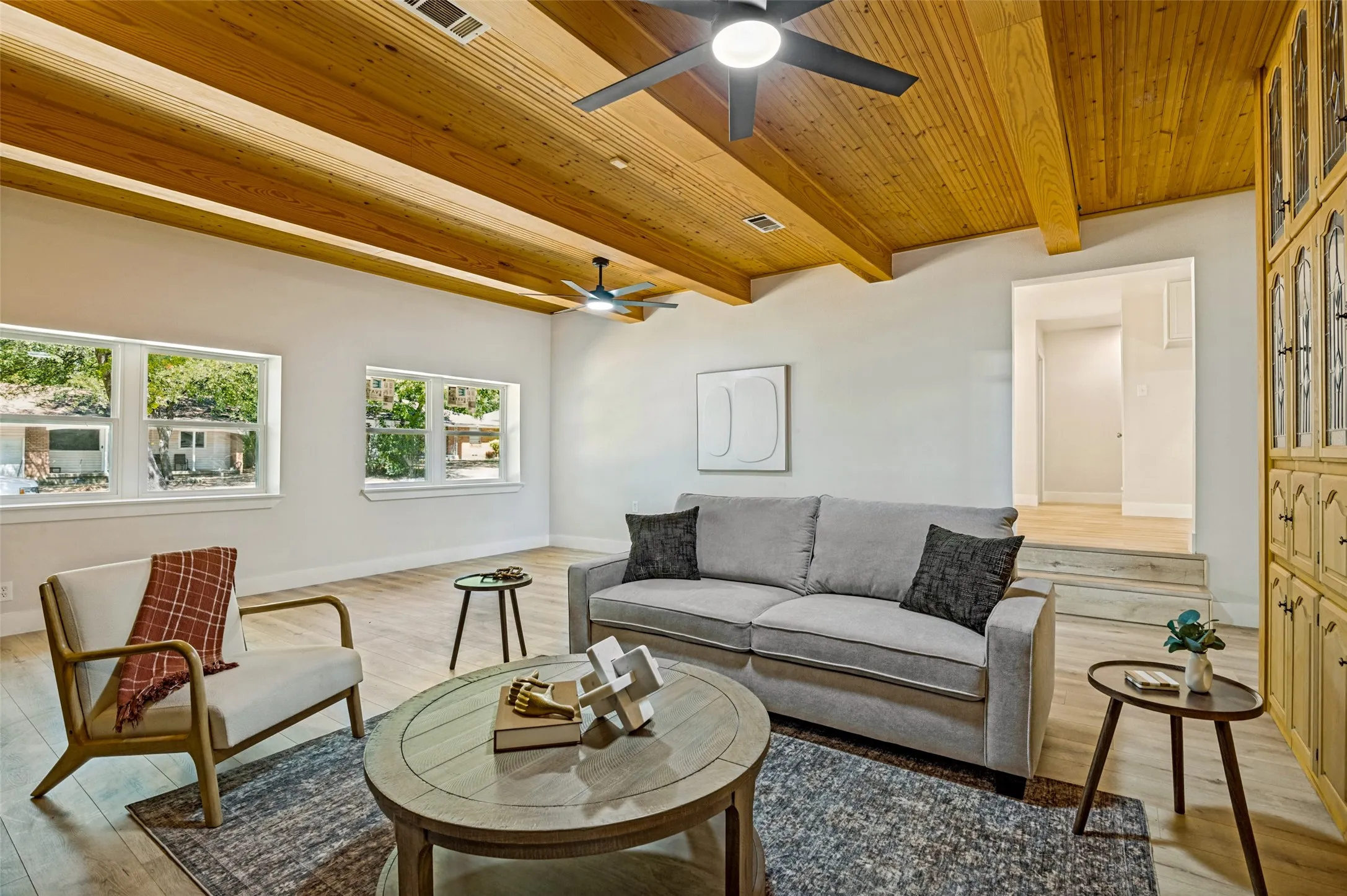 Vaulted wood-paneled ceiling with exposed beams