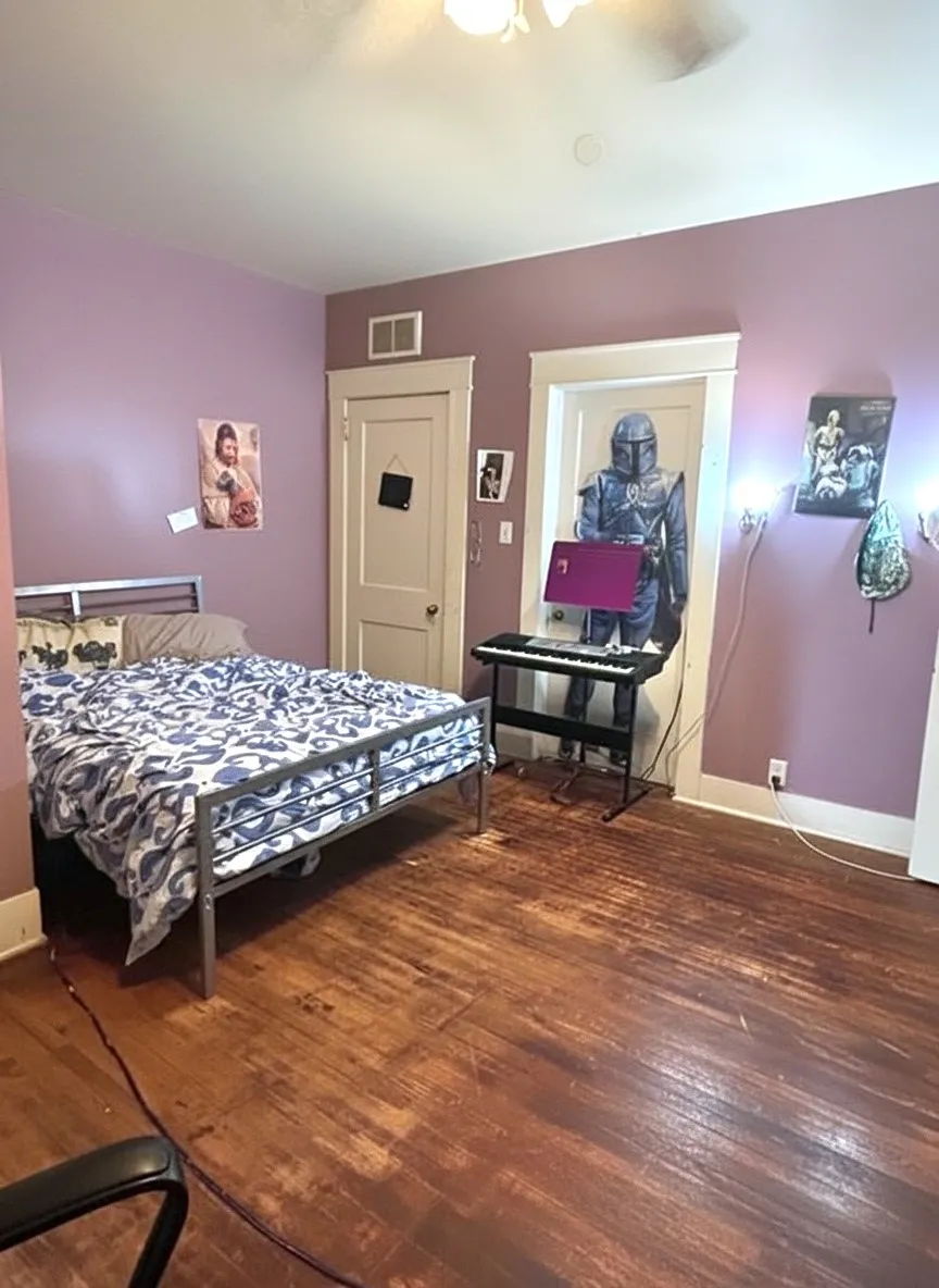 Wood-finish flooring with a ceiling-mounted light fixture, and white trim