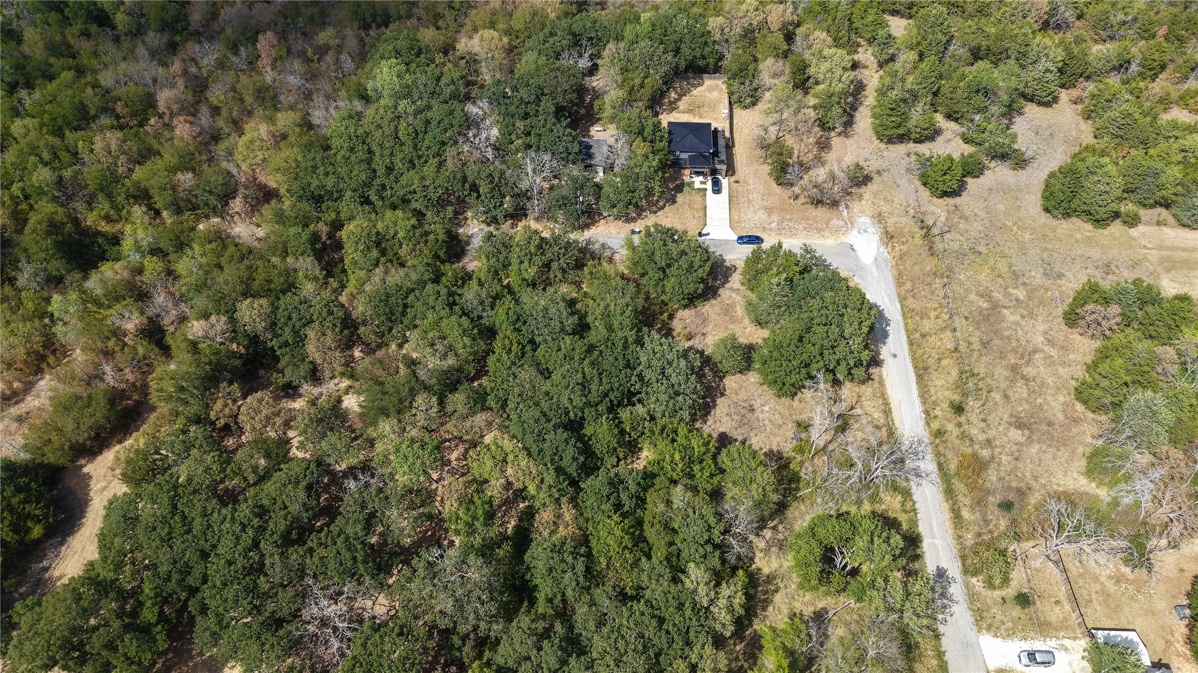 Wooded lot with a private driveway