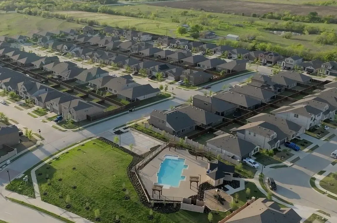 Community amenities include a fenced swimming pool with a covered seating area