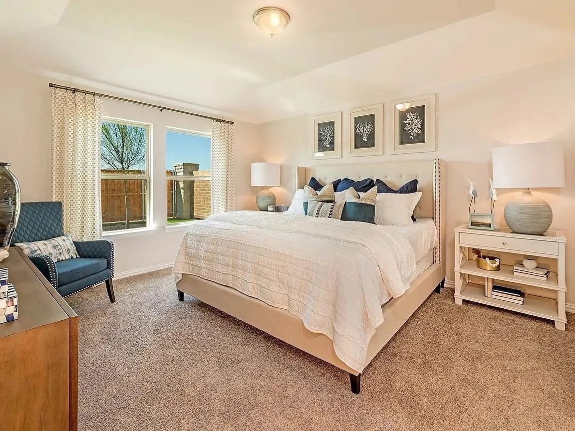 Tray ceiling, recessed lighting, neutral carpet flooring, and dual windows