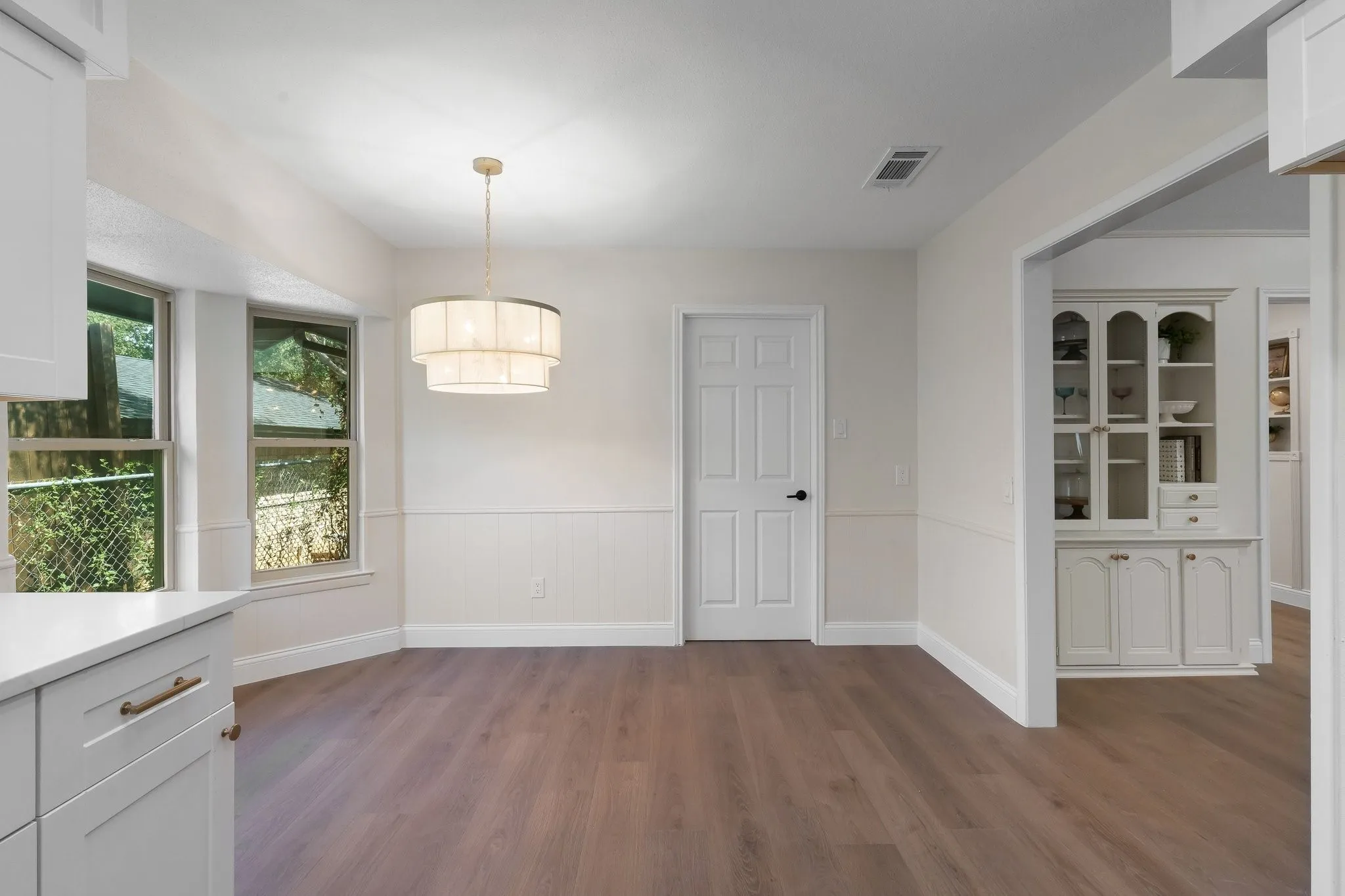 Breakfast nook with tiered drum pendant light