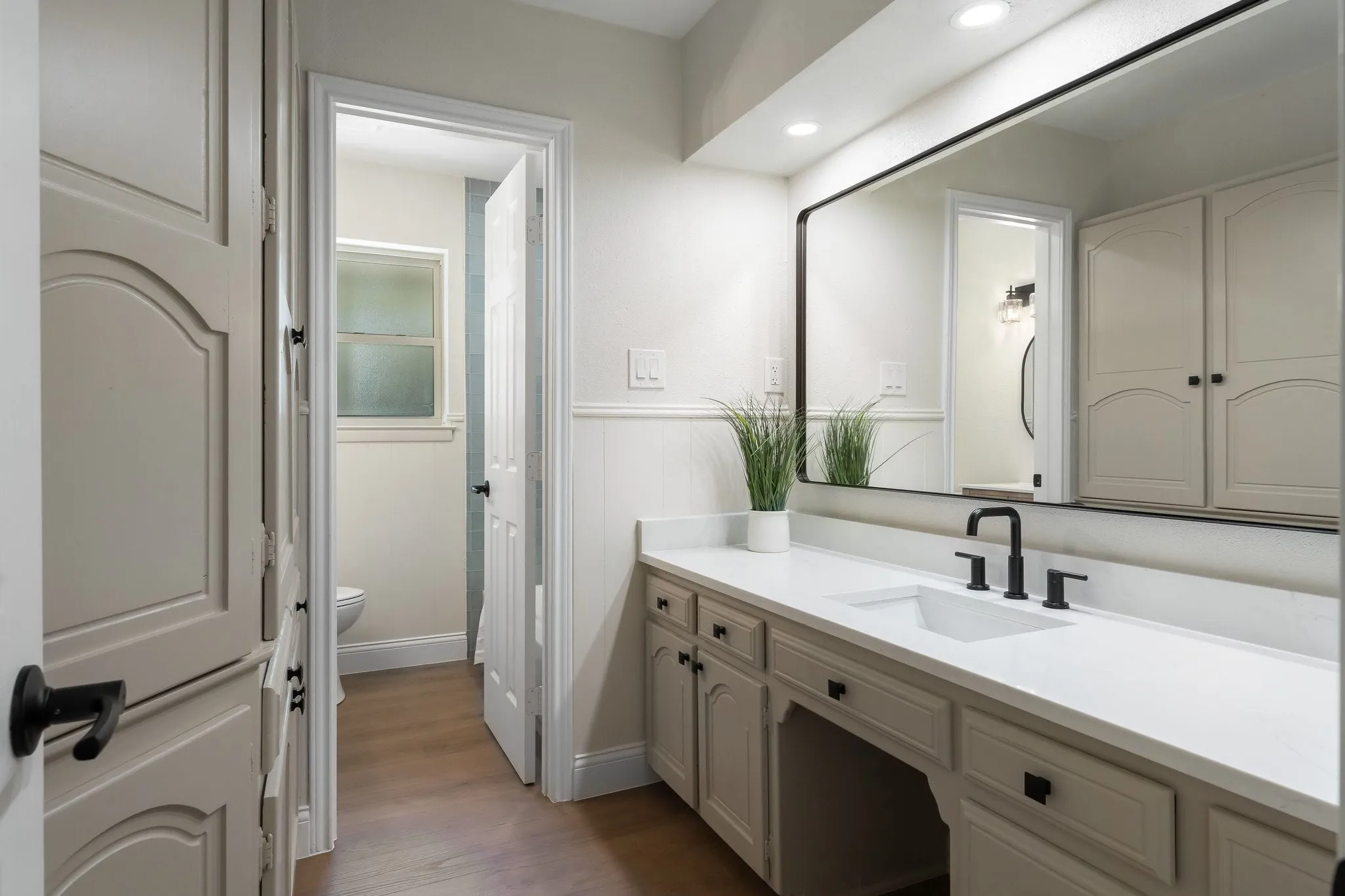 Fresh paint, new quartz, lighting, mirrors and faucets