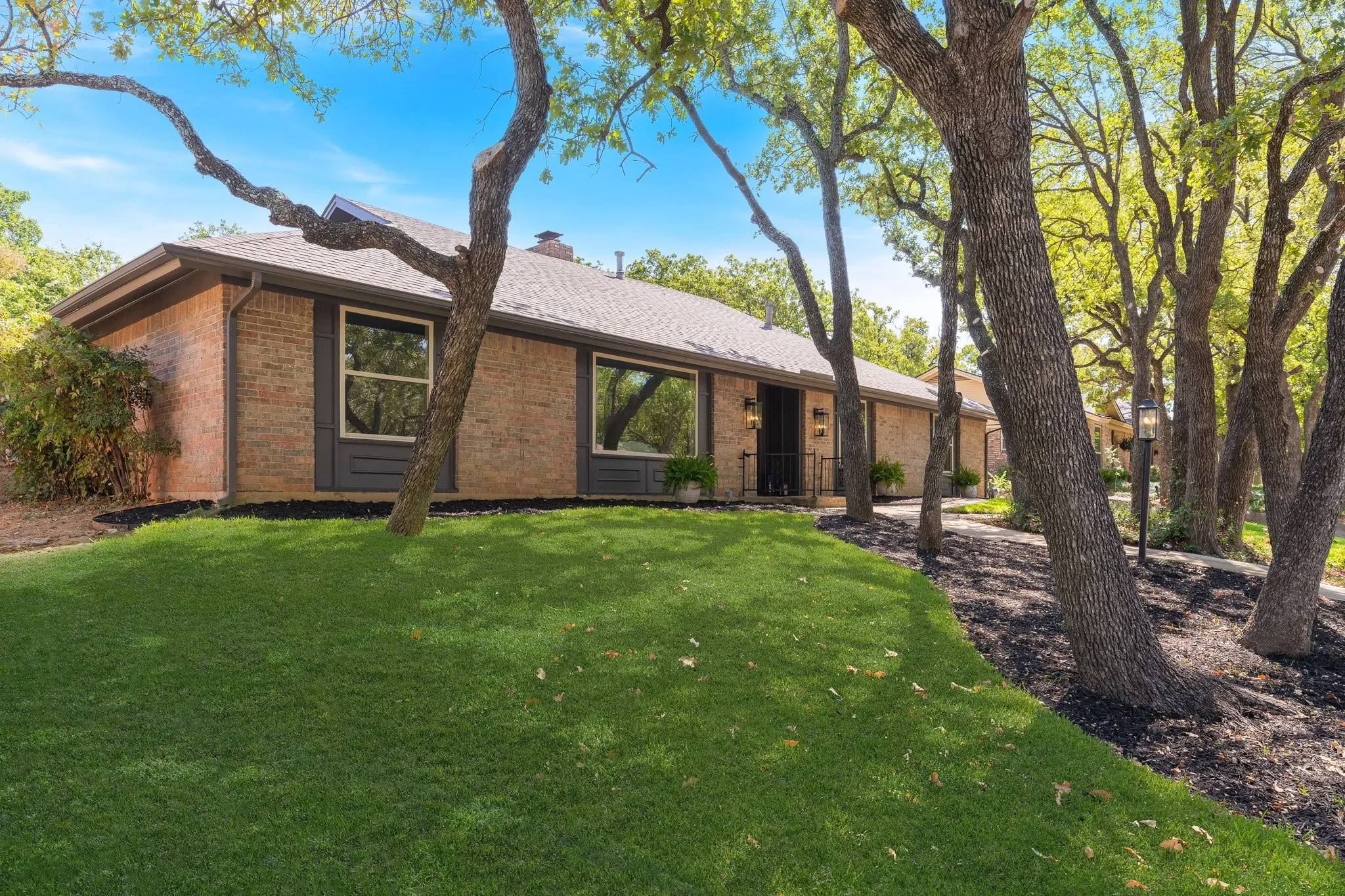 New windows, fresh exterior paint and new  sod.