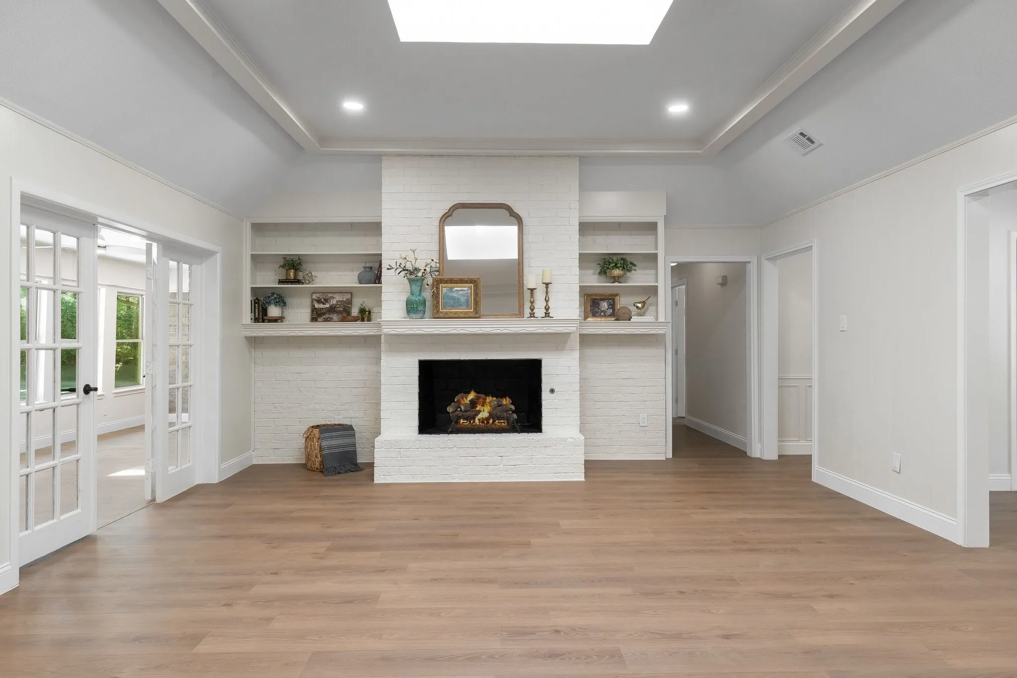 Vaulted ceiling, skylight, and fireplace with gas starter