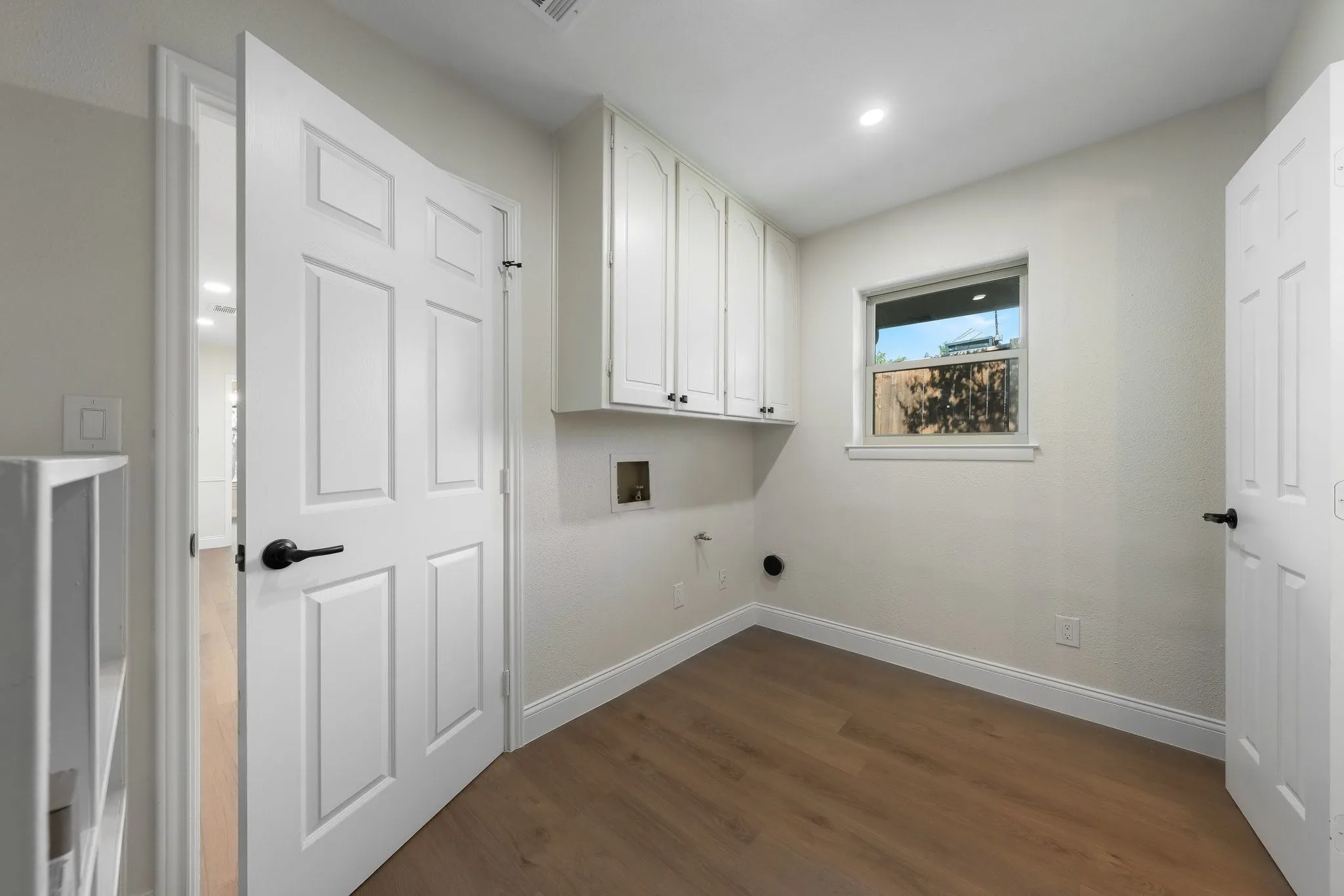 Utility room with cabinetry