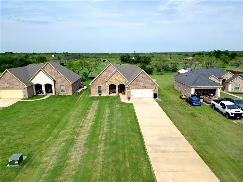 Brick exterior home with an attached two-car garage