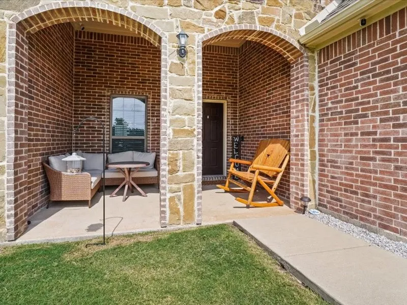 Stone and brick facade with arched entries