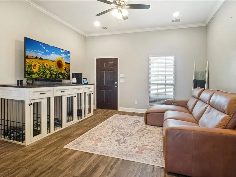 Wood-finish flooring, crown molding, and recessed lighting