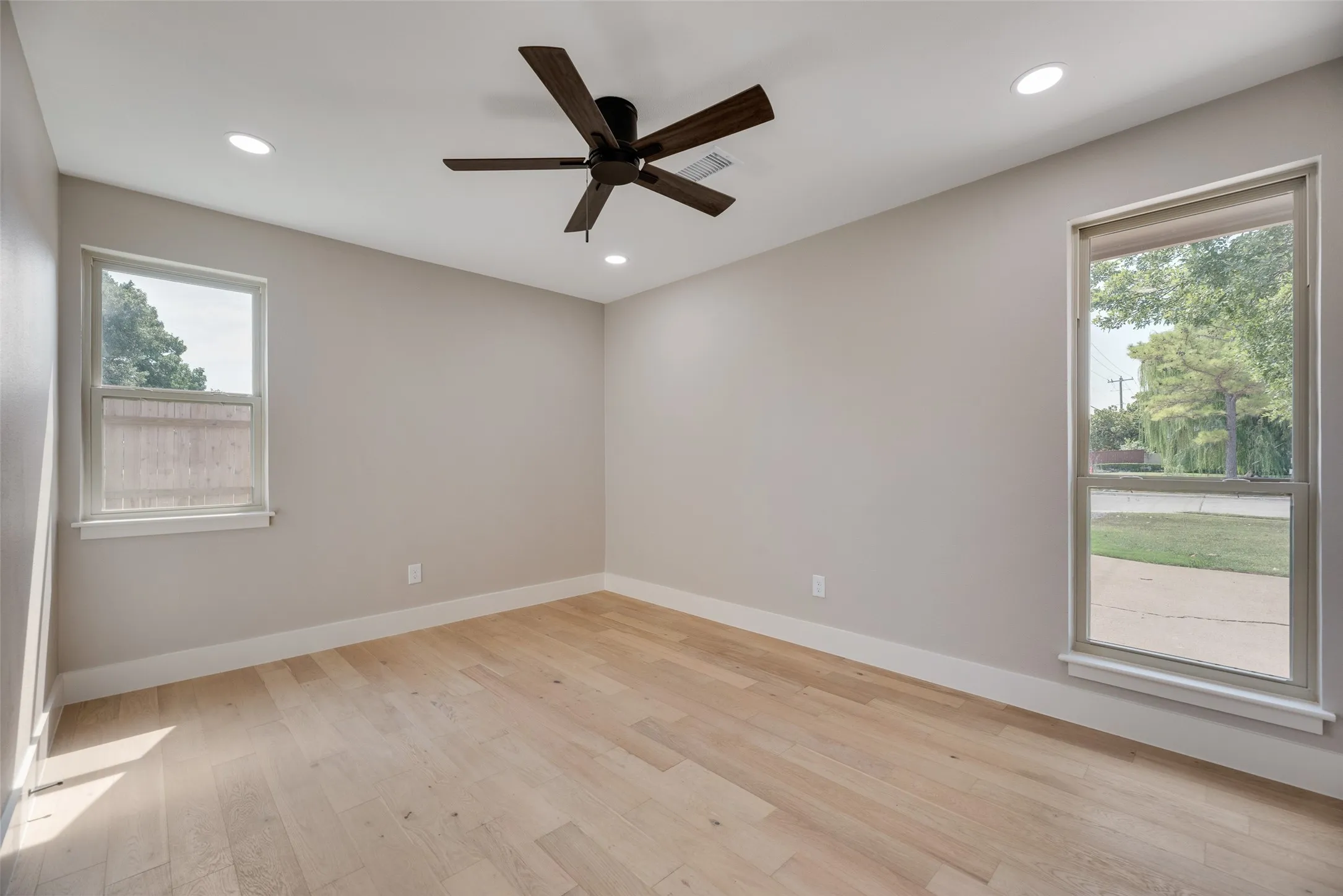 2nd bedroom featuring light wood finished floors, recessed lighting, and ceiling fan
