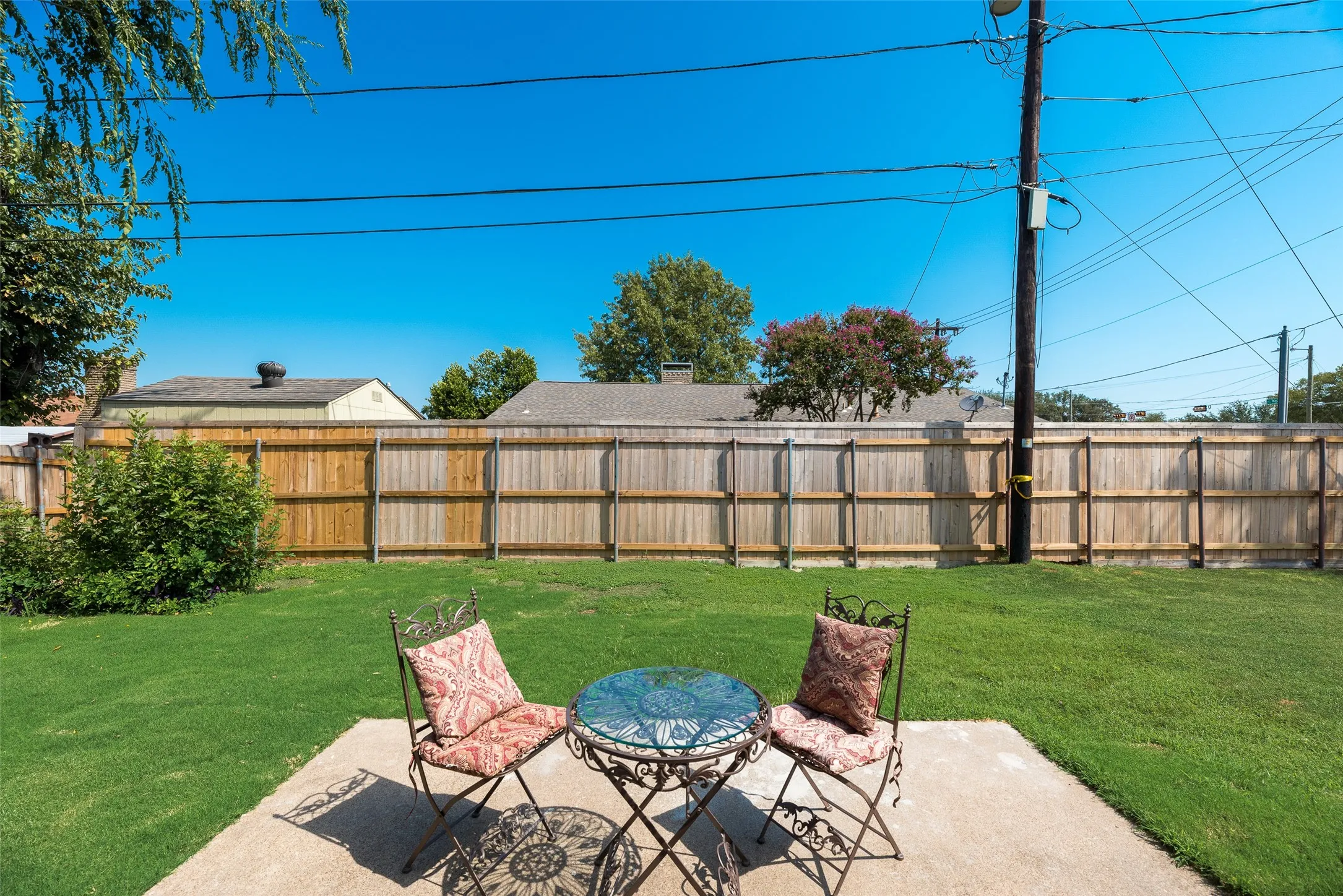 Fenced backyard with a patio area