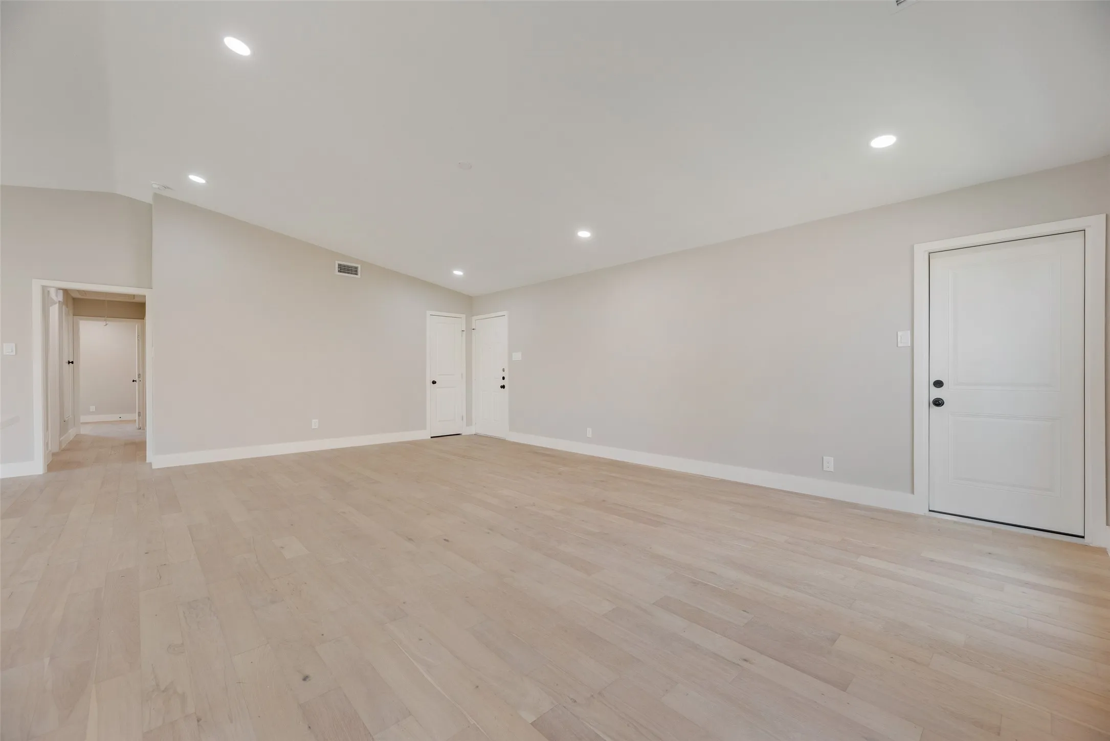 Open layout featuring light wood-style floors and recessed lighting