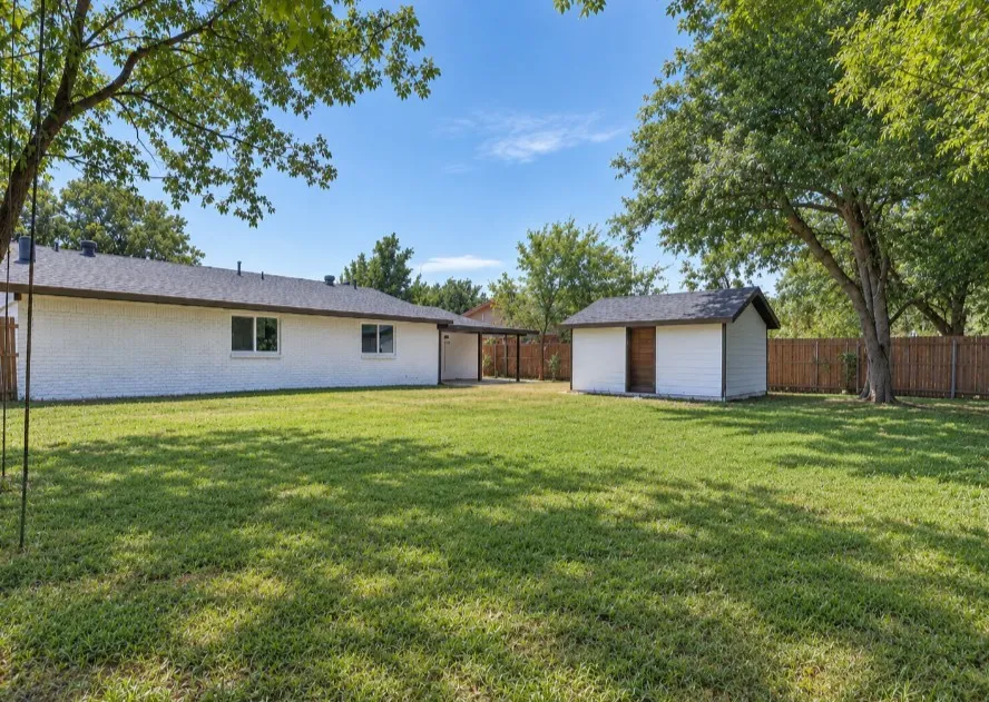 Grass is AI generated to enhance listing photo