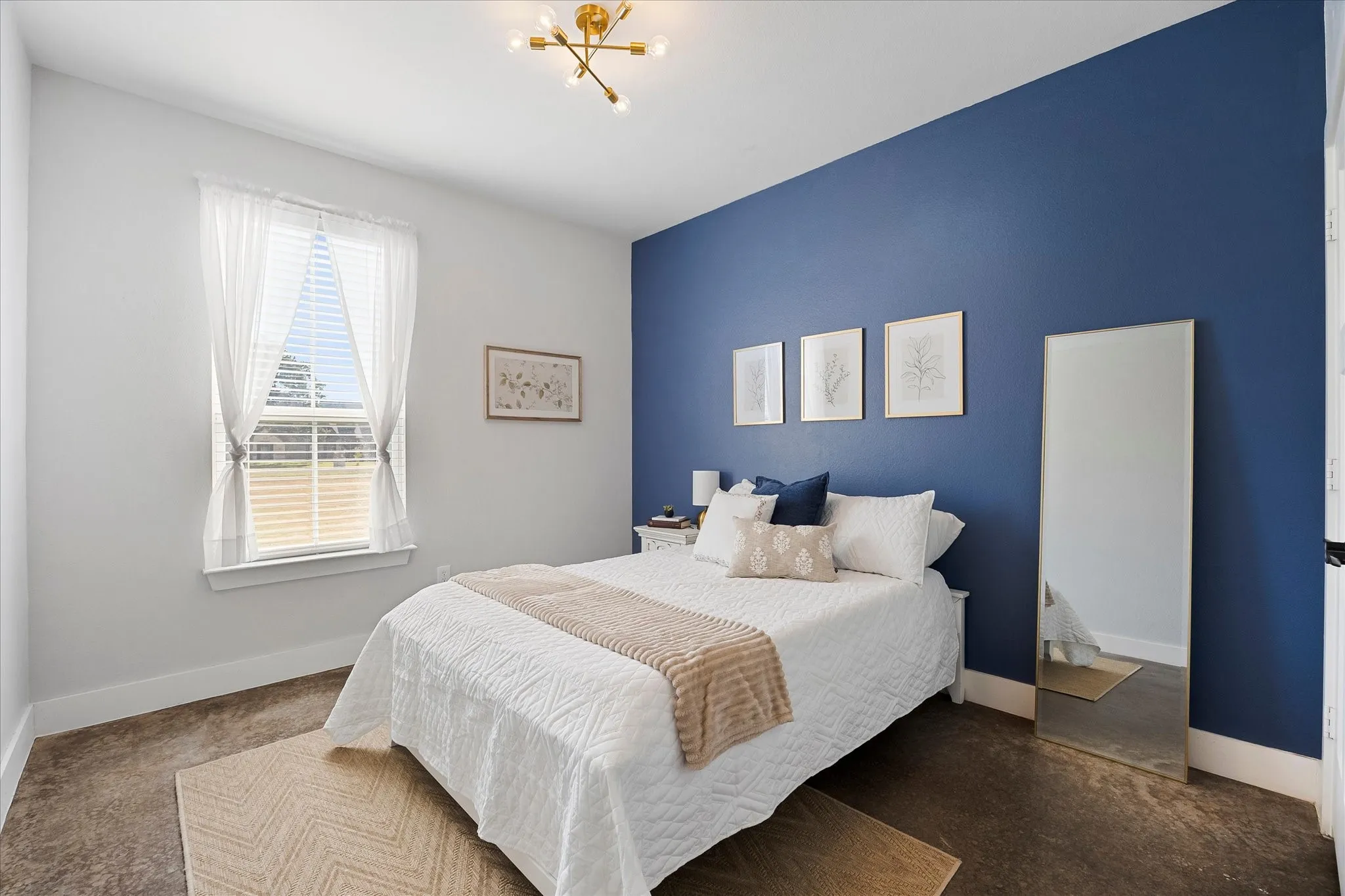 Bedroom 3 offers trendy lighting and accent wall.