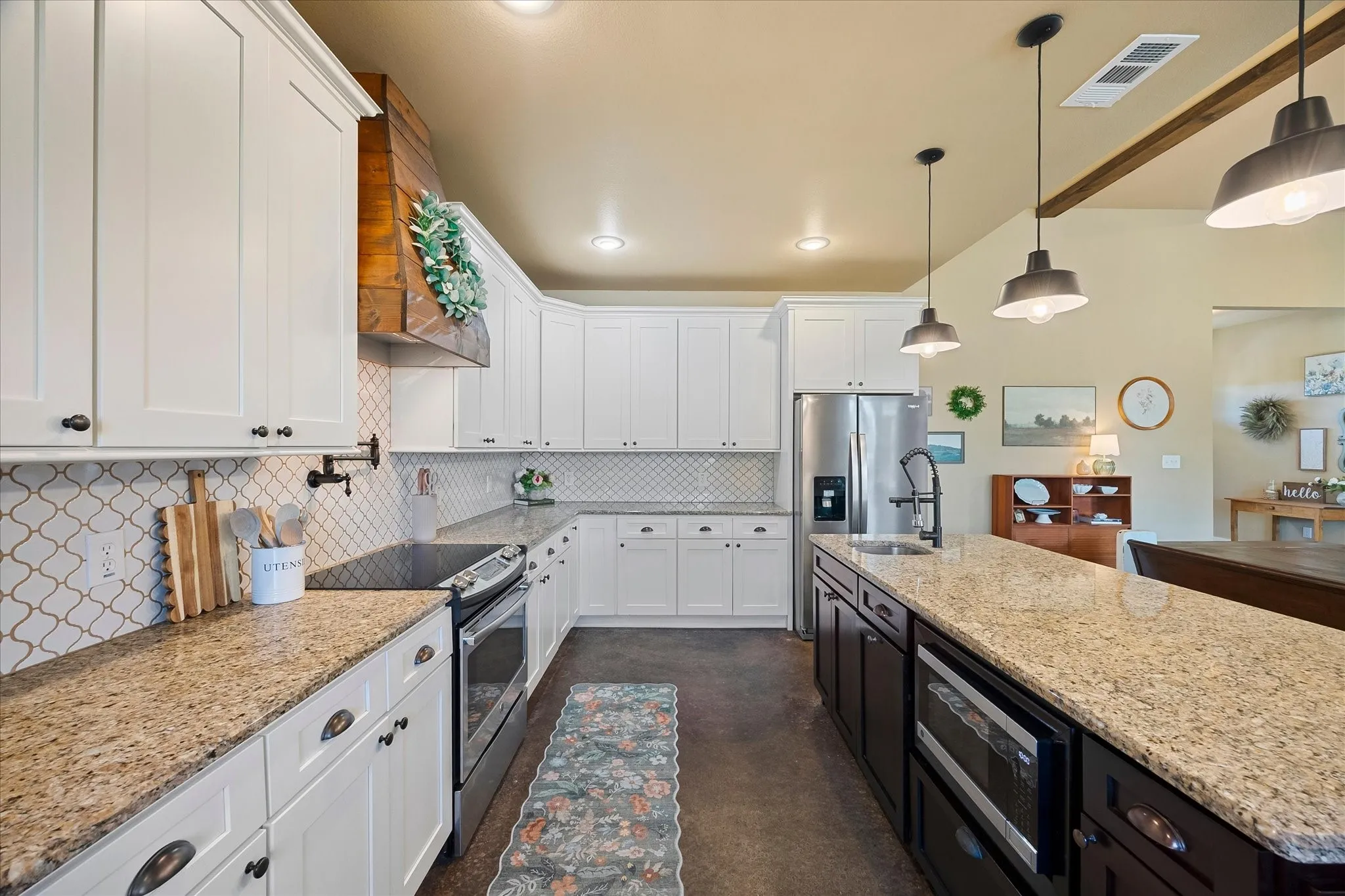 It includes a 5-burner range with convection oven and convenient pot filler.