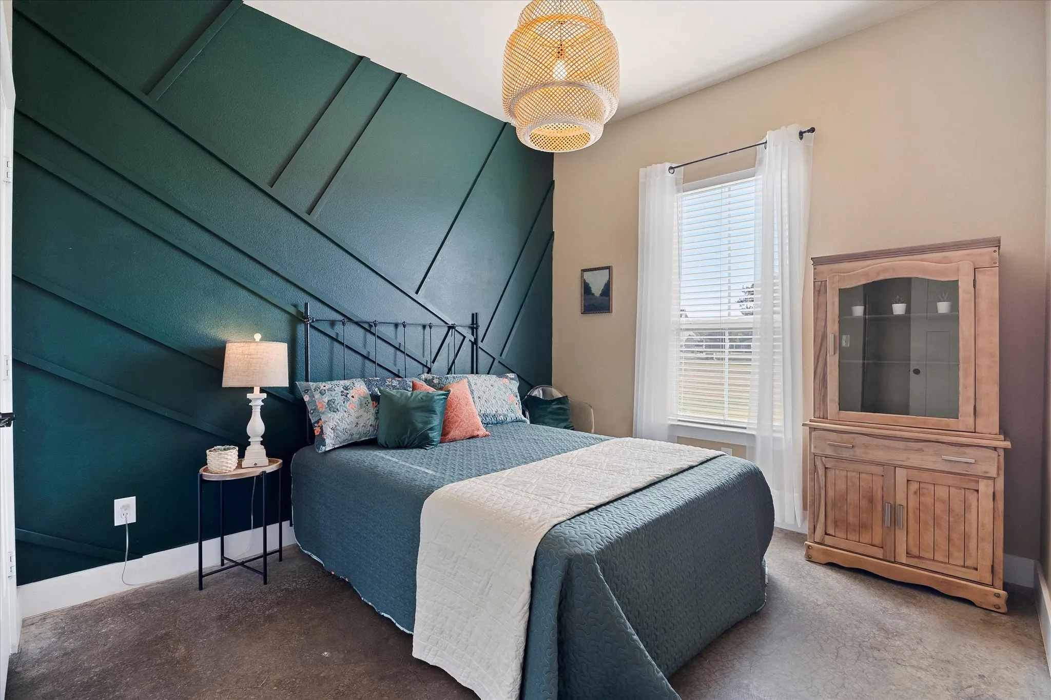 Bedroom 2 features an accent wall, designer lighting and deep closet with built-ins.
