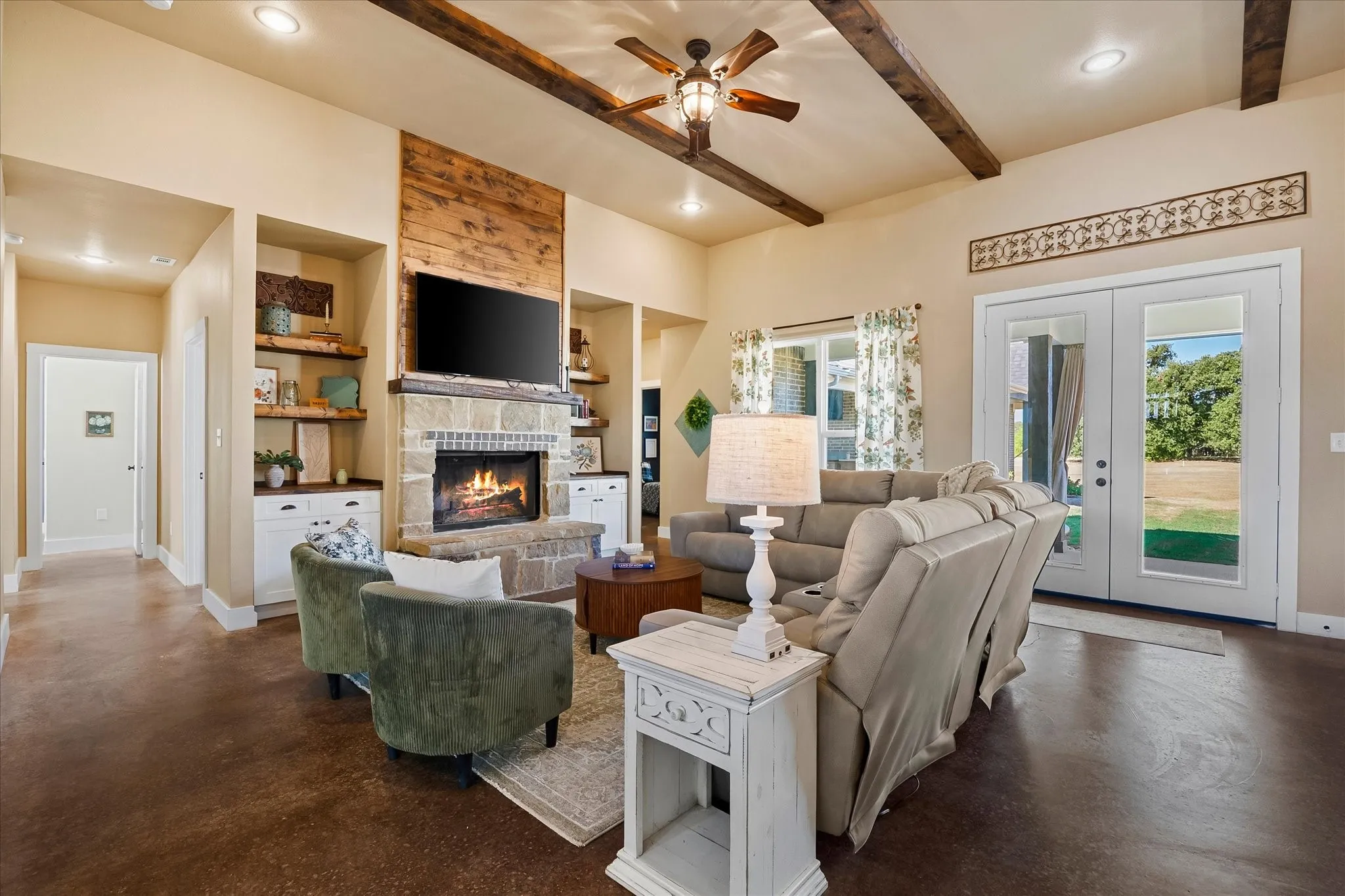 The focal point of the warm and inviting Family Room is the stone wood-burning fireplace.
