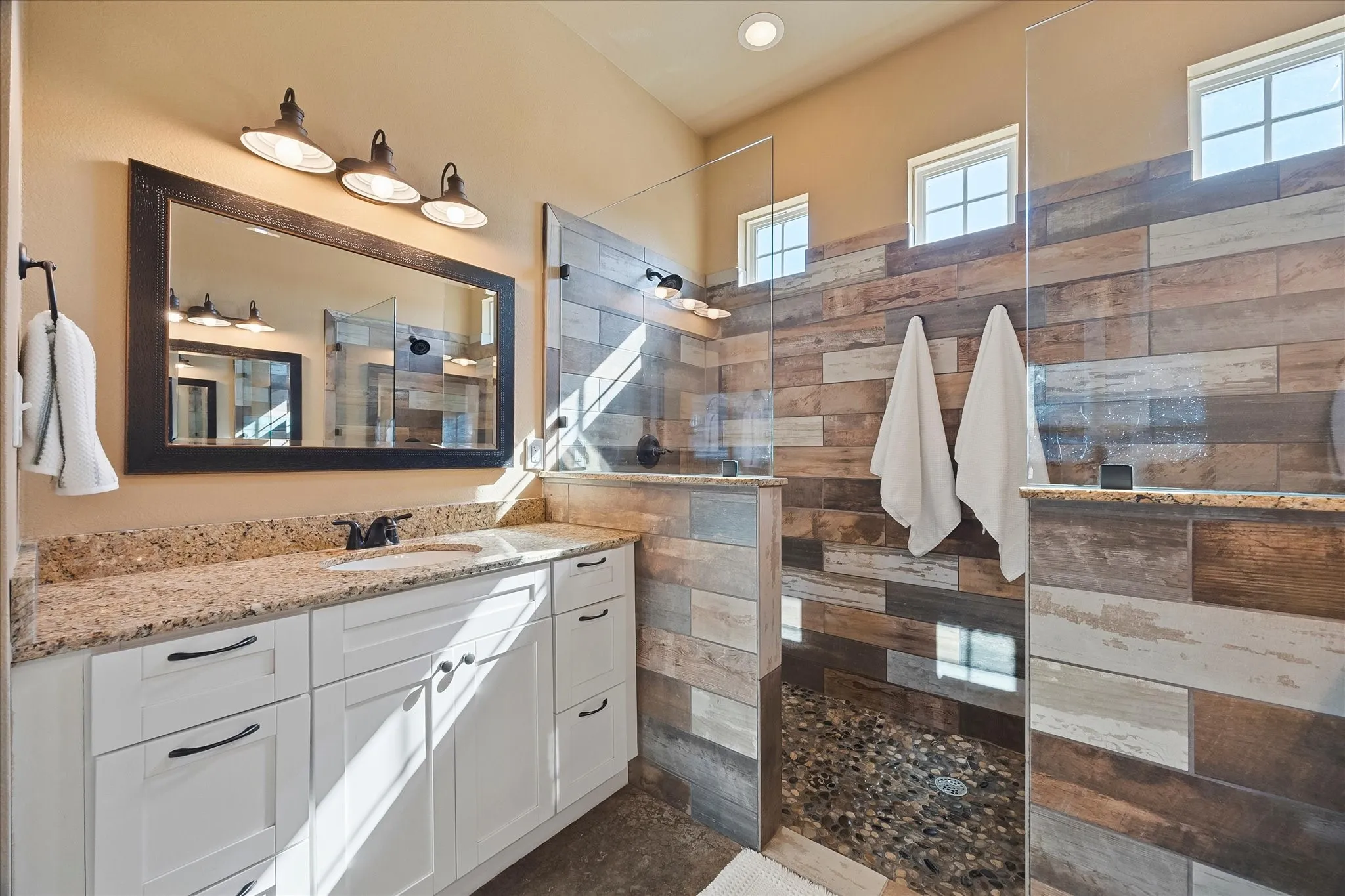 Getting ready at the same time is easy when there are 2 separate vanities and  showers!
