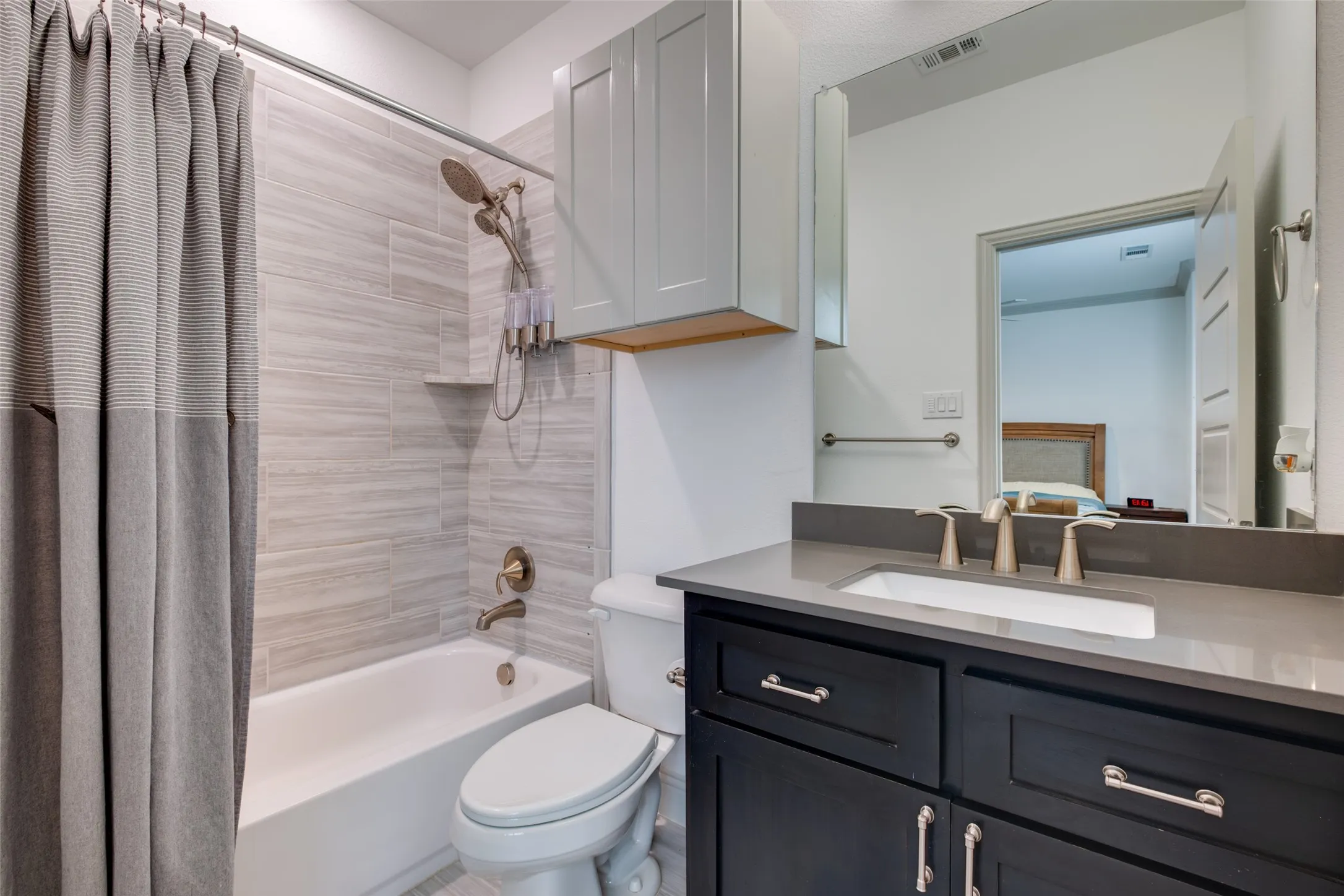
Nicely appointed secondary bathroom with decorator tile