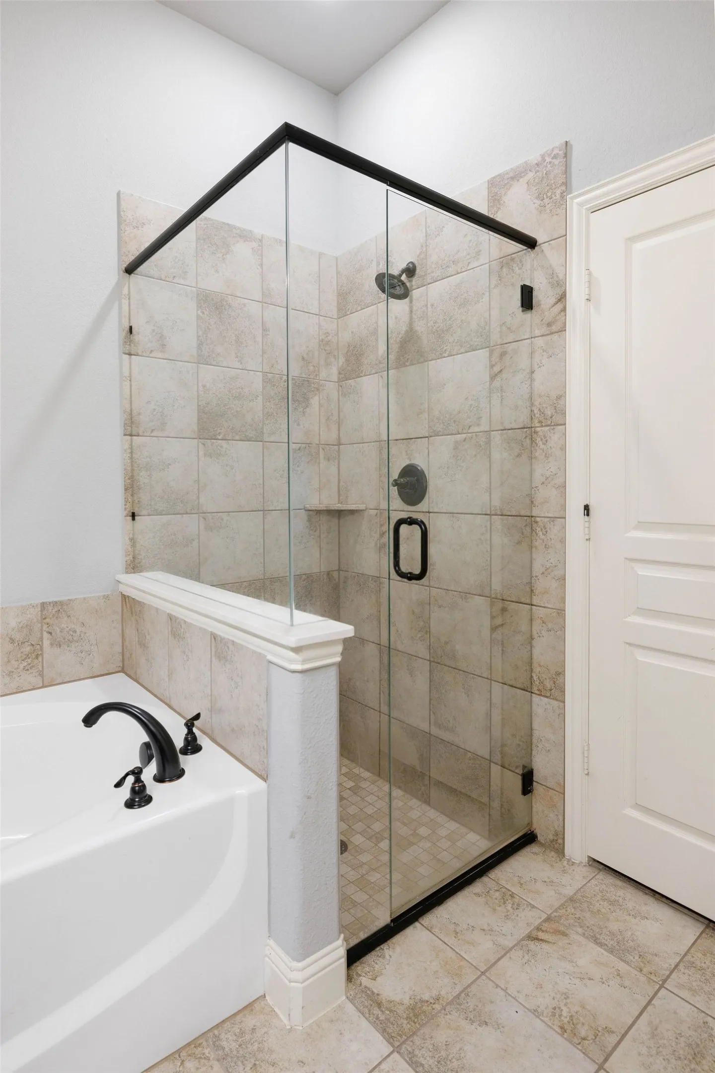 Bathroom featuring independent shower and bath